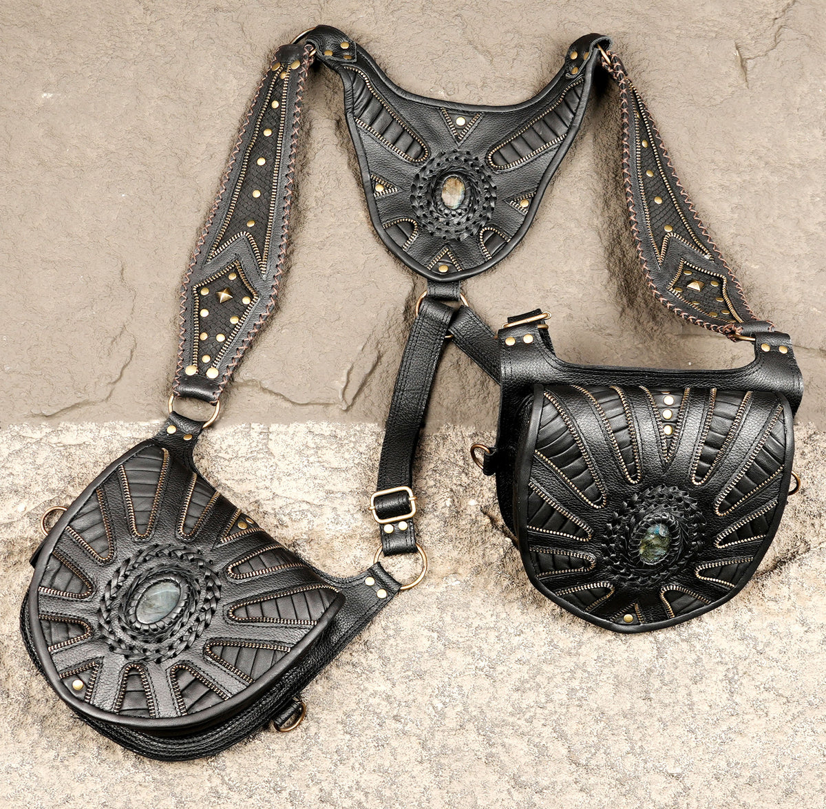 Black leather double pocket shoulder rig with decorative studded panels
