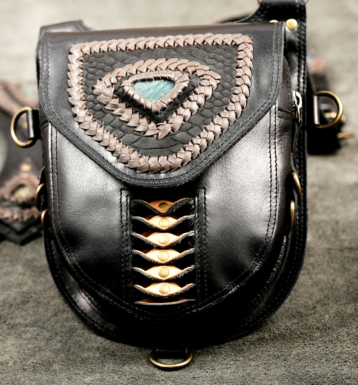 Black Leather Shoulder Bag Set with Ornamental Braiding and Adjustable Harness Straps