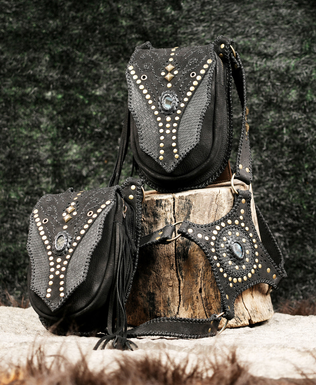 Handmade leather thigh bag set with studded flap pockets for rave and music festival outfits.