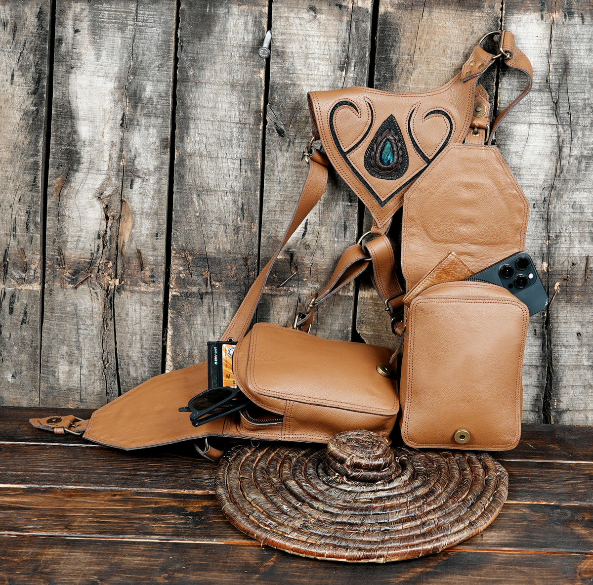 Tan leather shoulder harness with decorative black panel detailing