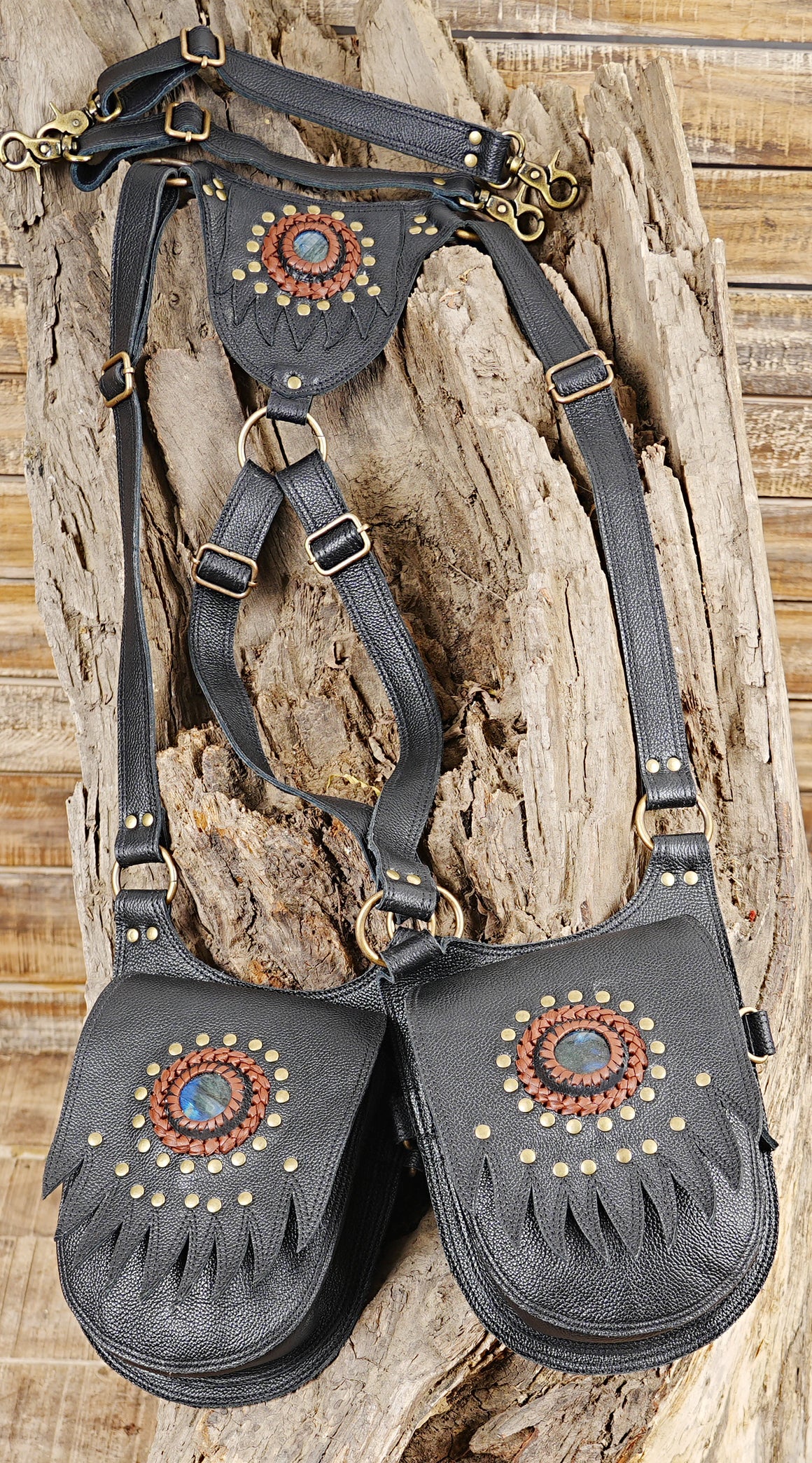Handmade black leather festival bag with shoulder harness and gemstone pocket details