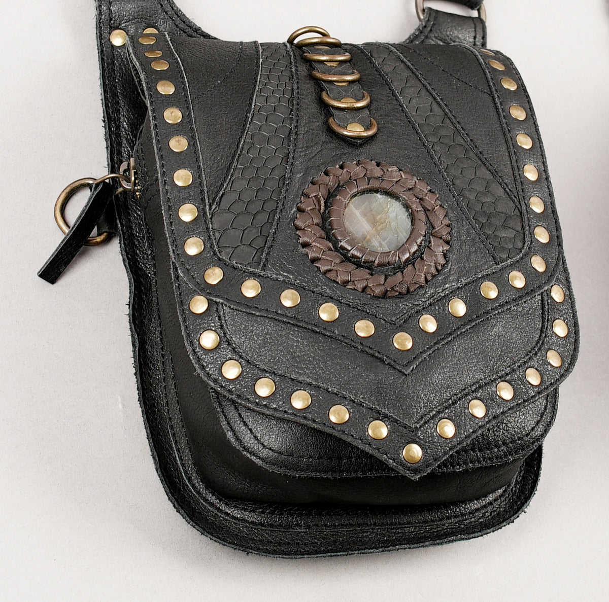 Black leather utility holster bag with adjustable buckles and connecting straps