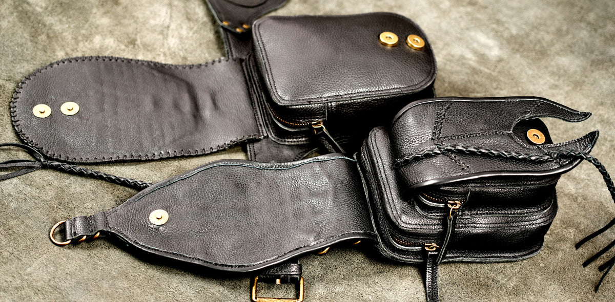 Cyberpunk utility waist pack in black cowhide with decorative metal rivets