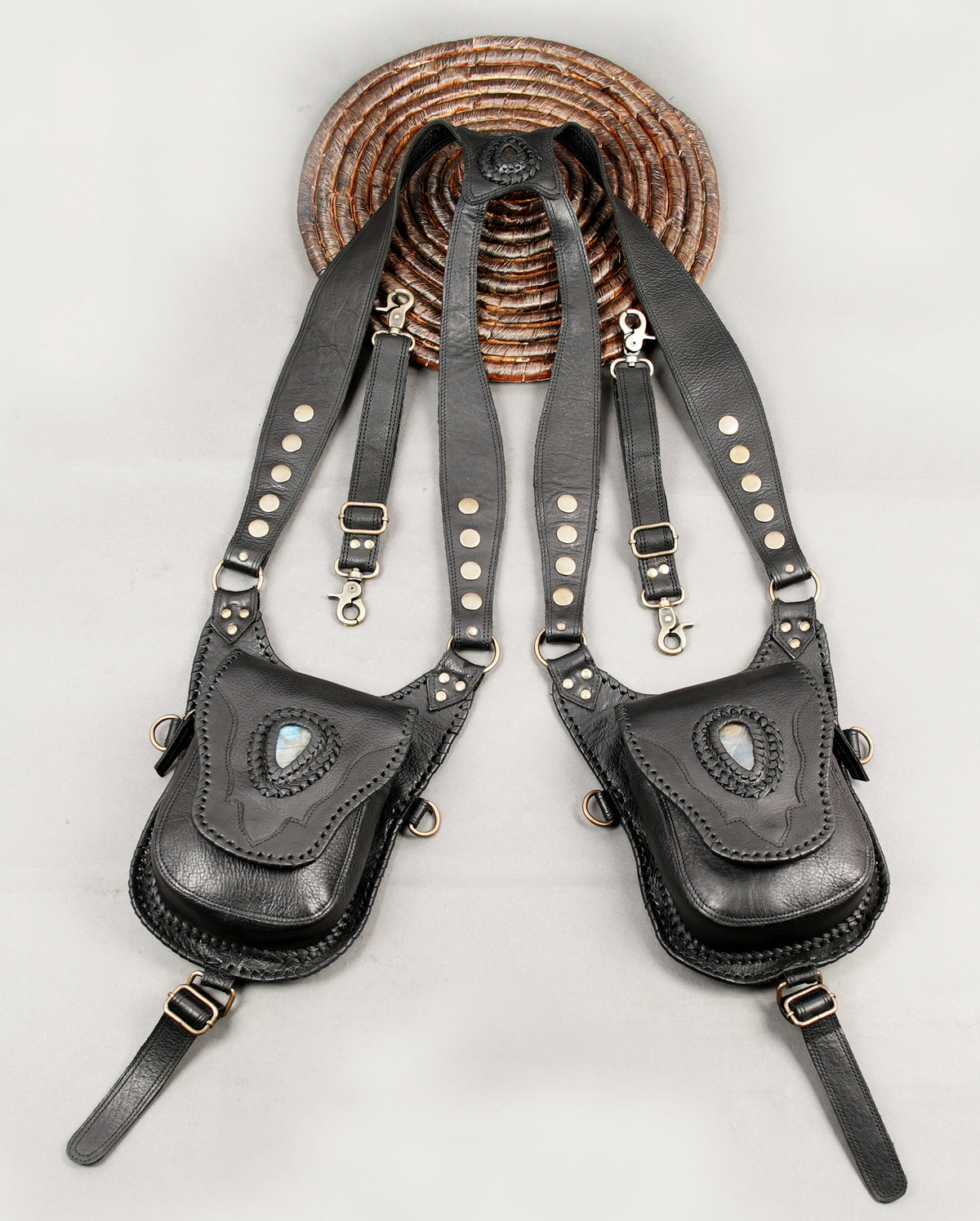 Black leather festival accessory with front hip bags and detachable-looking strap fitting