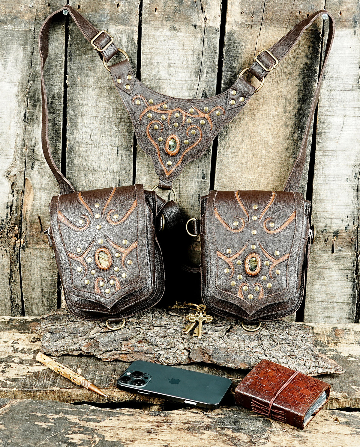 Black leather cosplay harness bag with brass studs and decorative stone accents