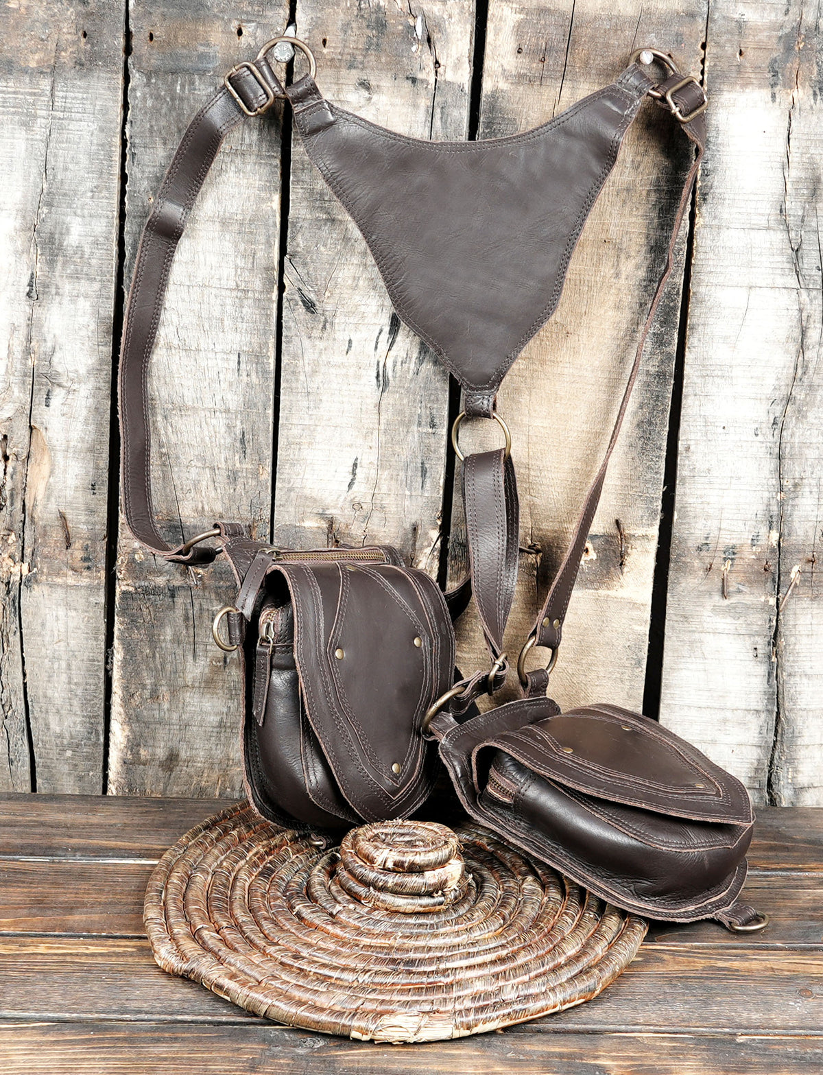 Gothic leather shoulder holster bag with two decorative flap pockets and adjustable straps