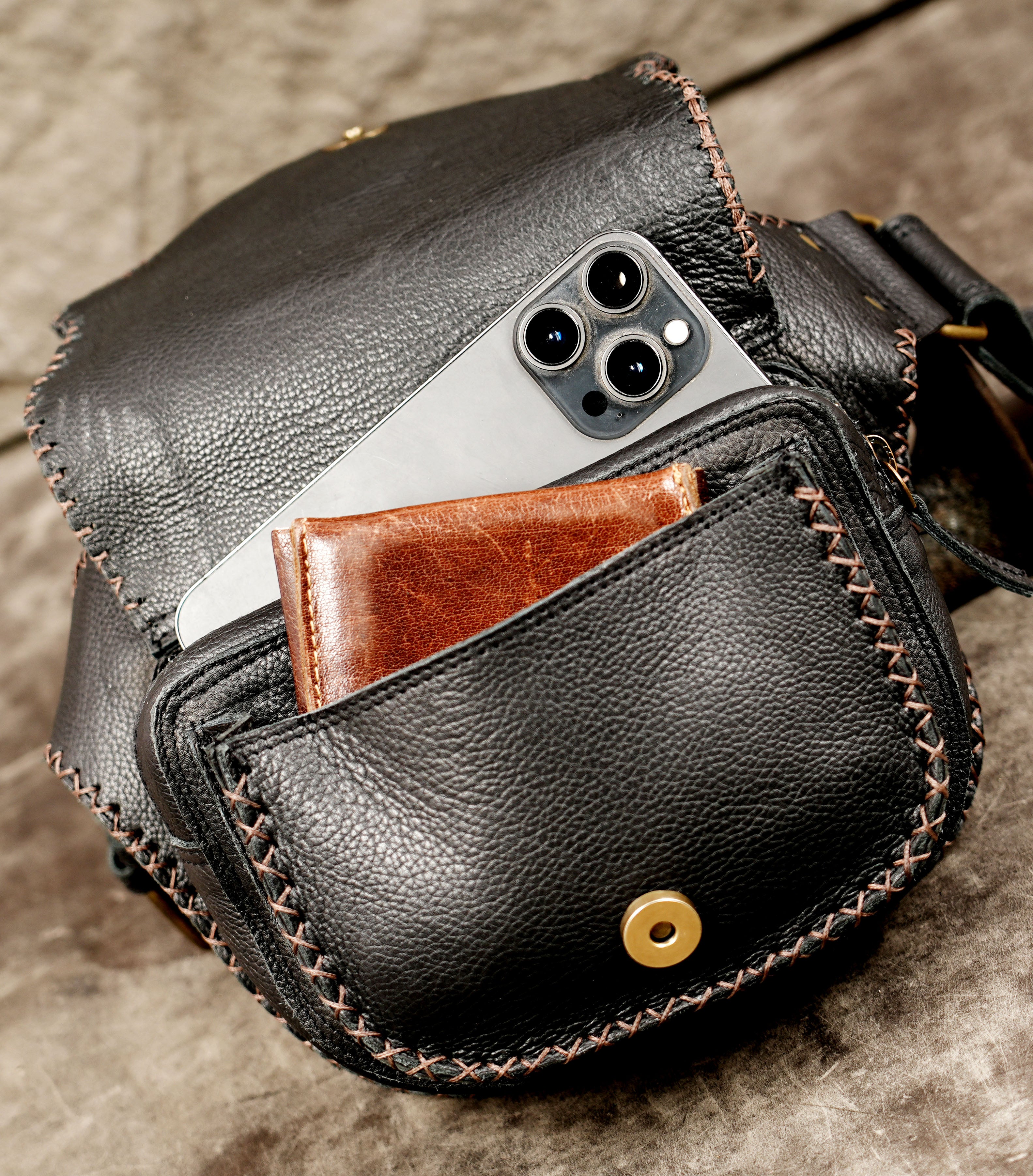 Festival-ready black leather waist bag with gemstone