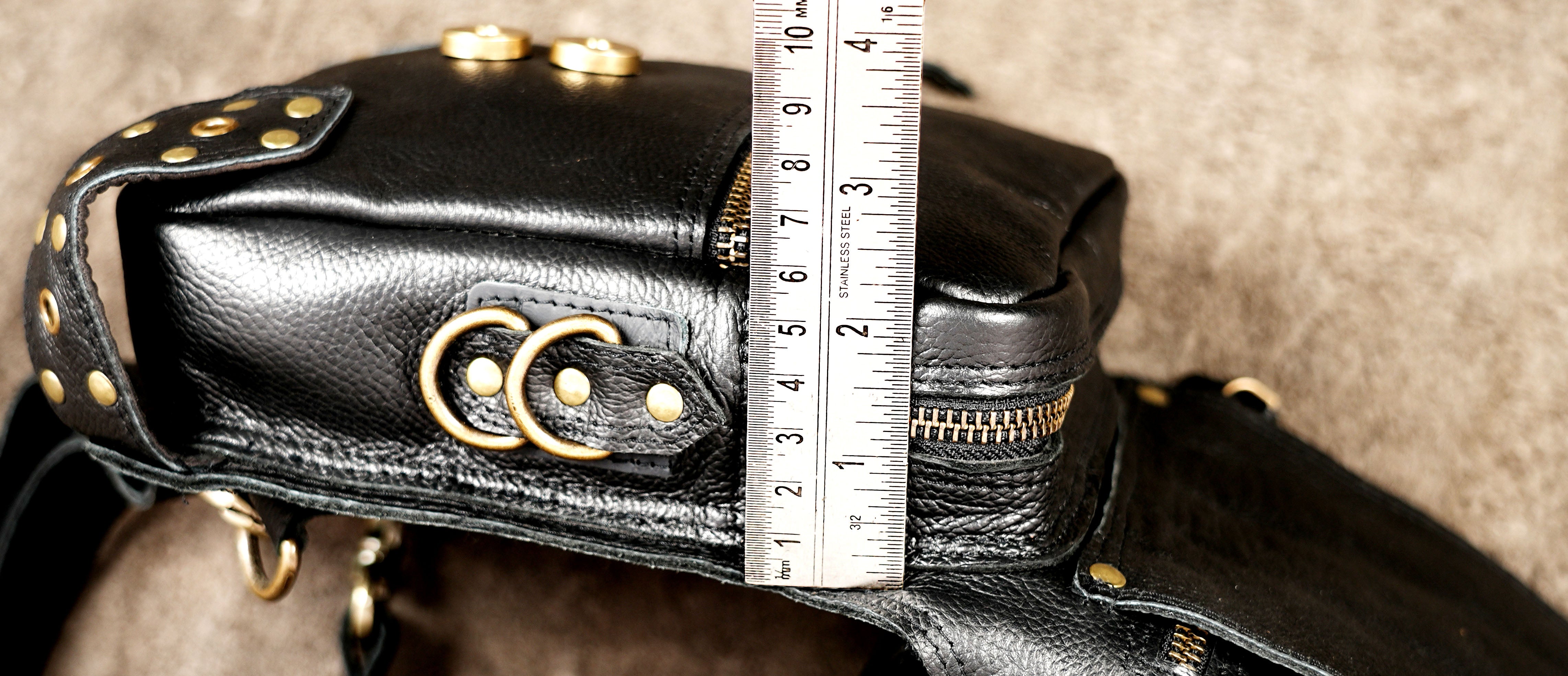 Festival leather waist pouch with studs, rings and zipper pocket