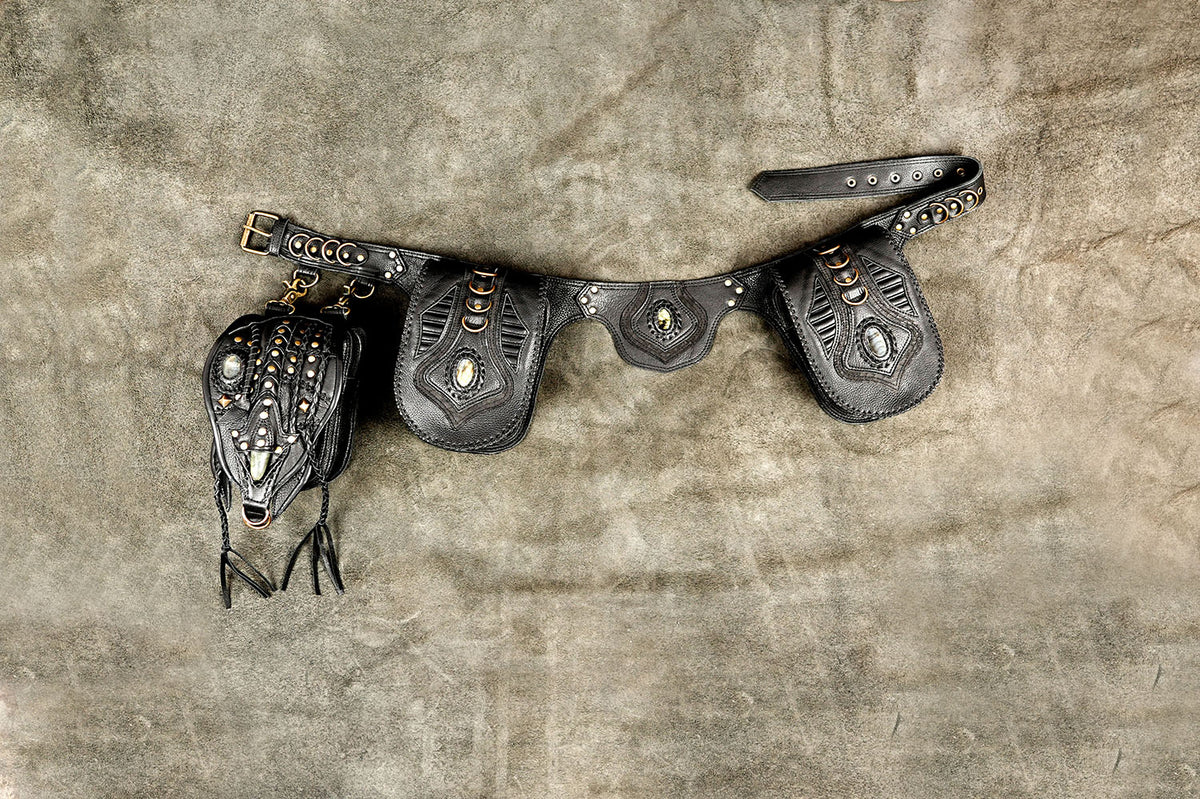 Black leather hip pouch belt with decorative panels and antique brass rings