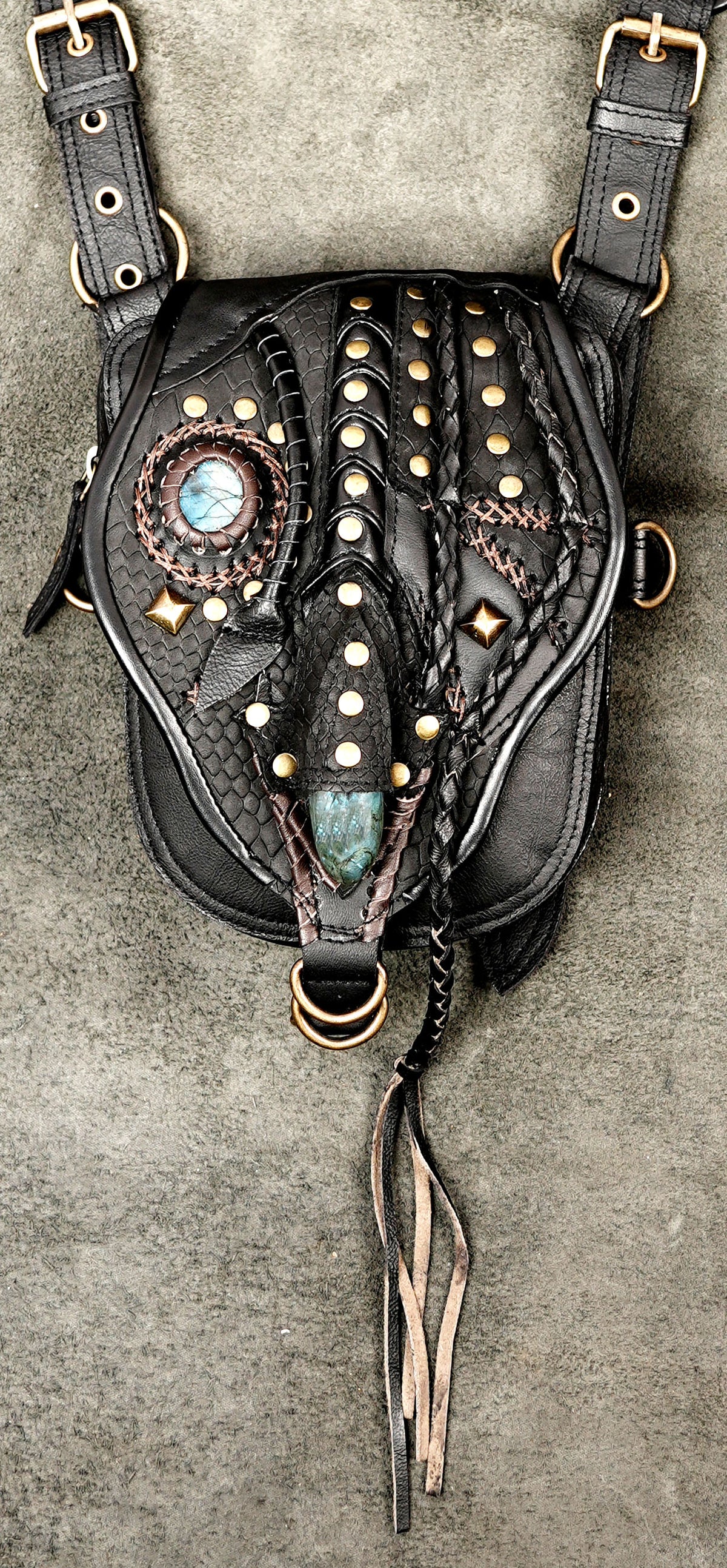 Black leather utility hip bags with studded panels and adjustable shoulder style straps
 