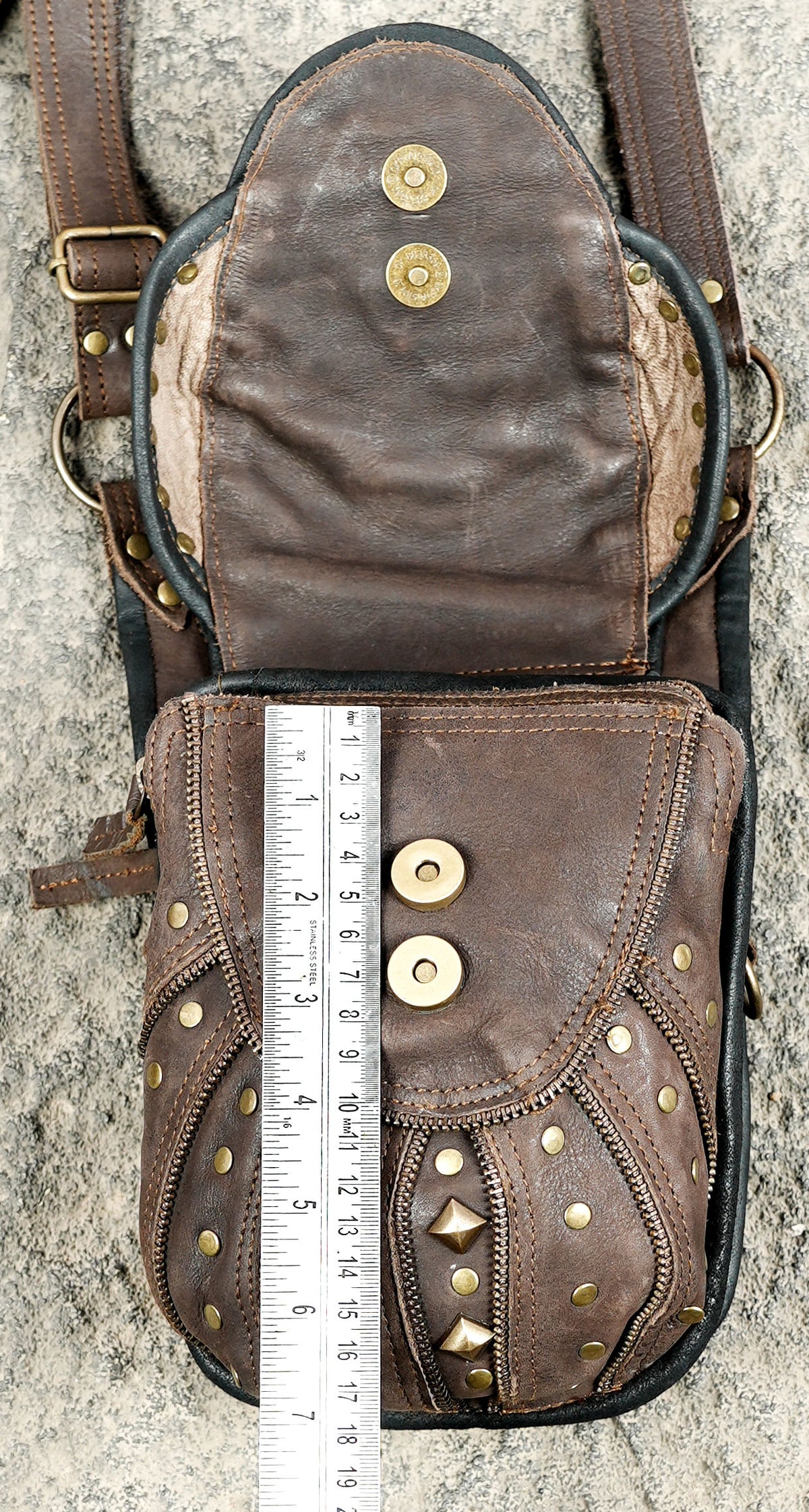Brown leather hip pouch harness with decorative studs and gemstone flap closures