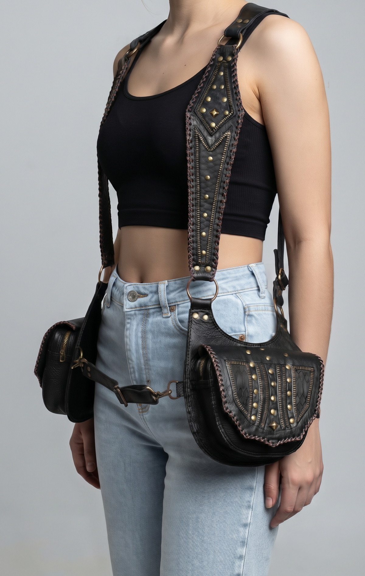 Black leather holster harness set with multiple straps and metal clasps