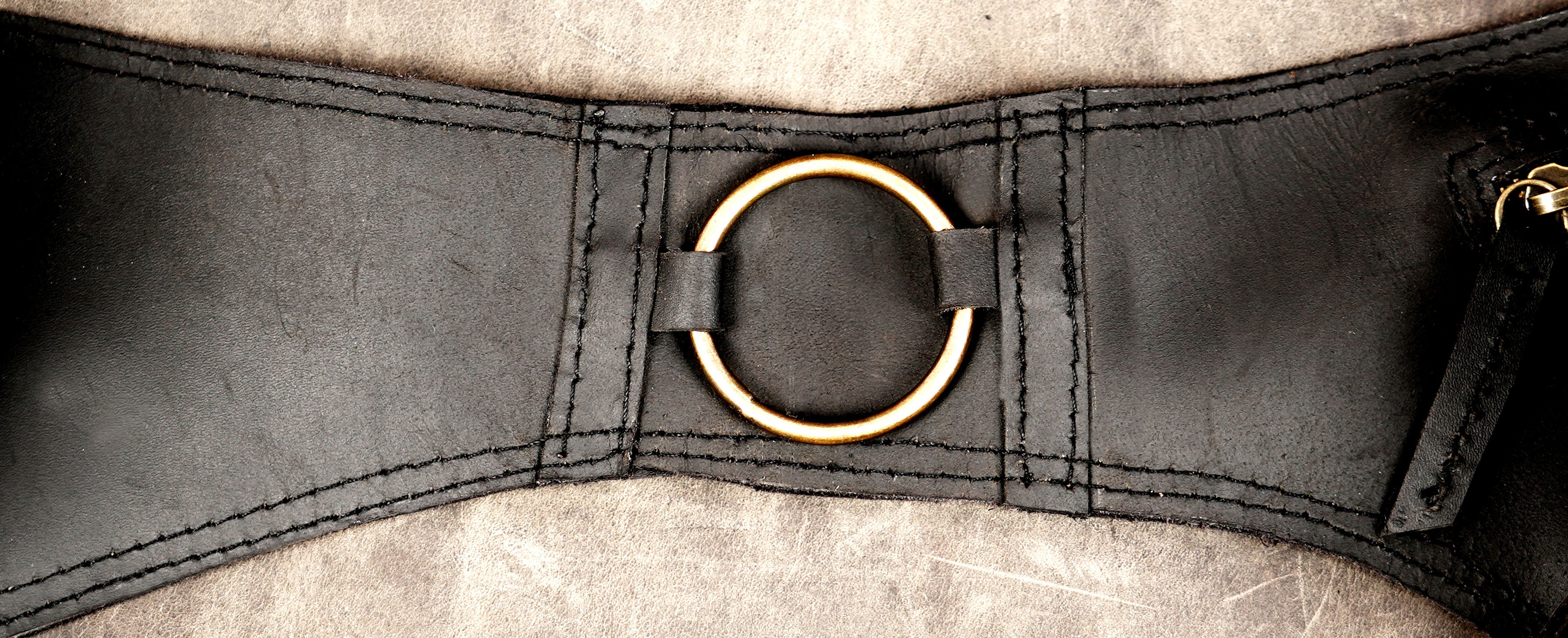 Genuine leather festival belt styled on stone background
