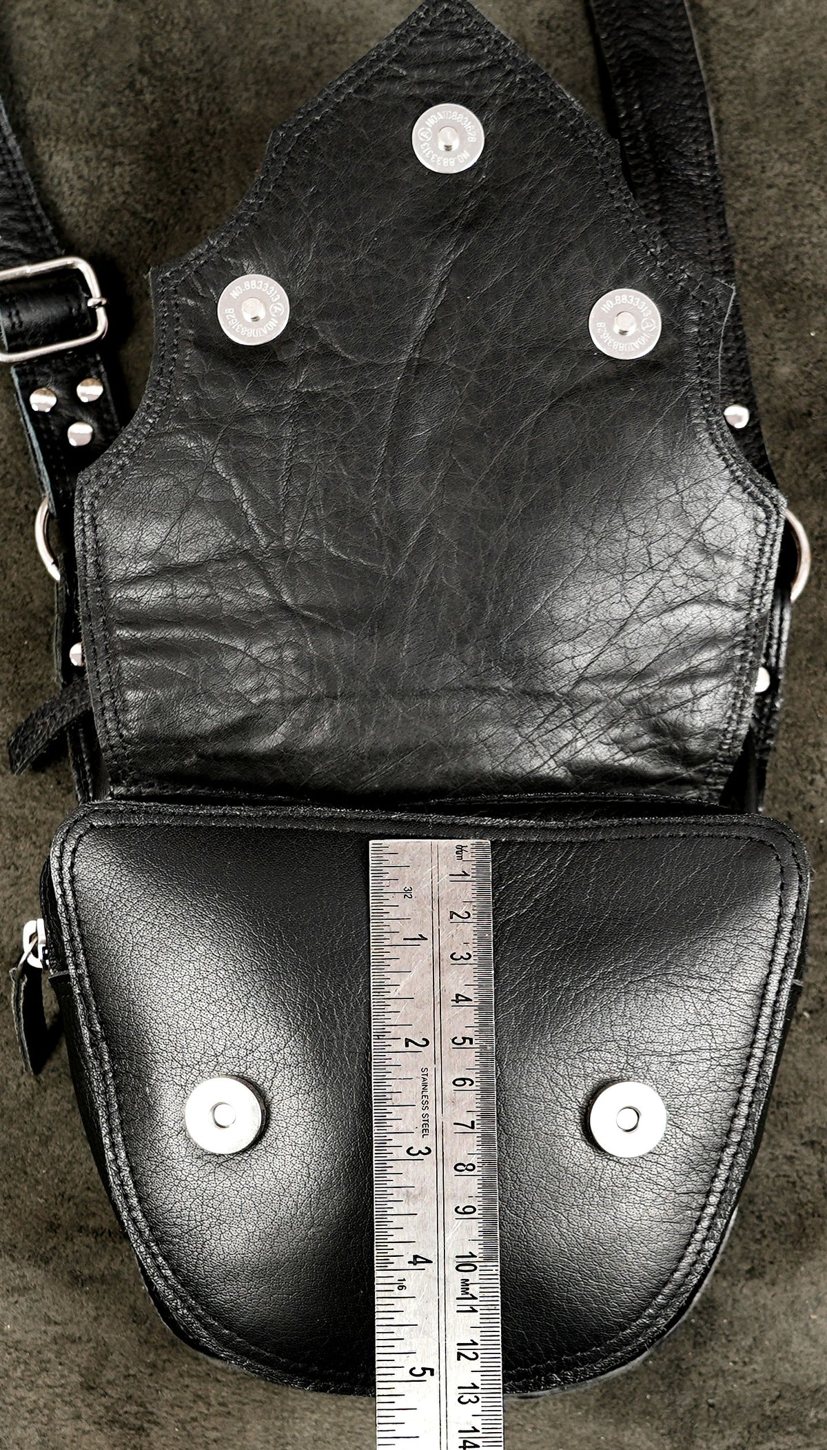 Genuine leather festival holster styled on stone background
