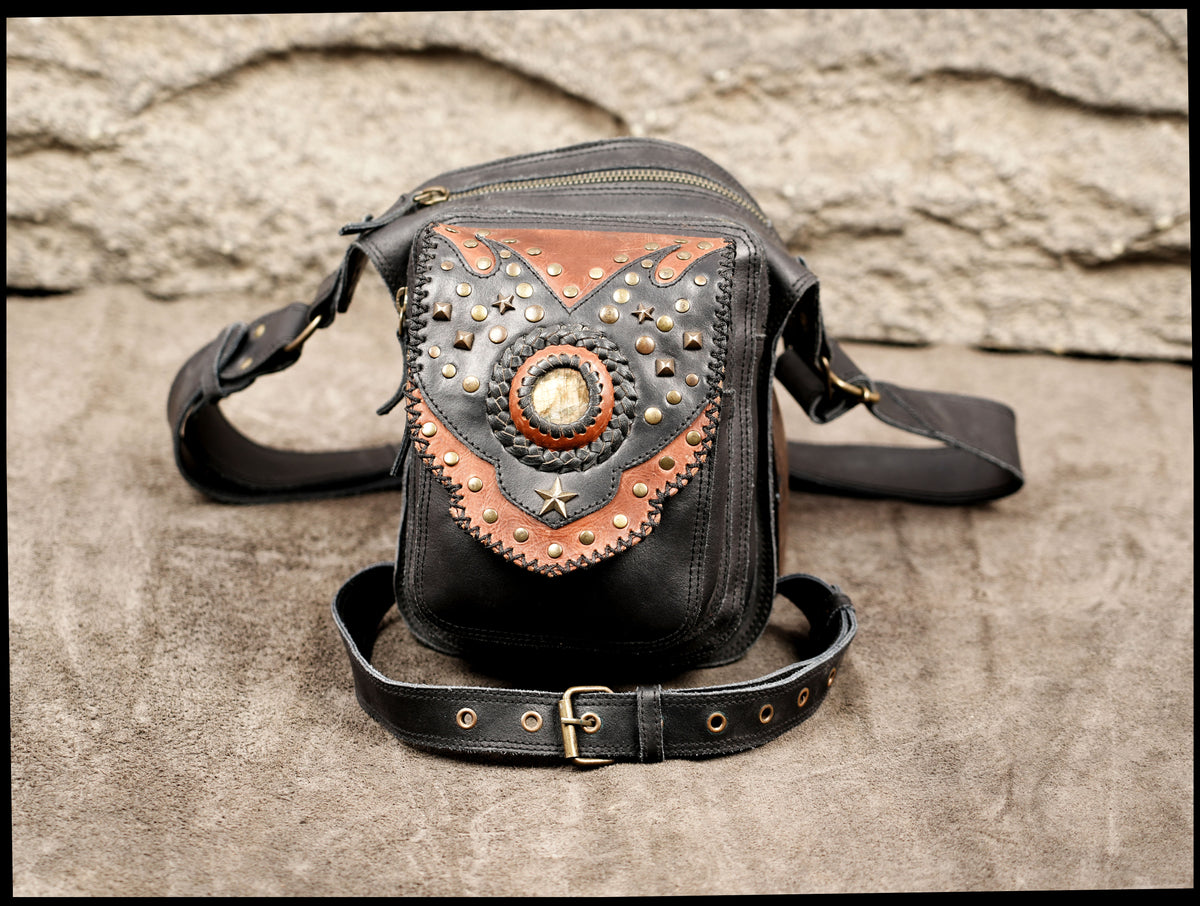 Genuine leather holster pouch styled on suede background