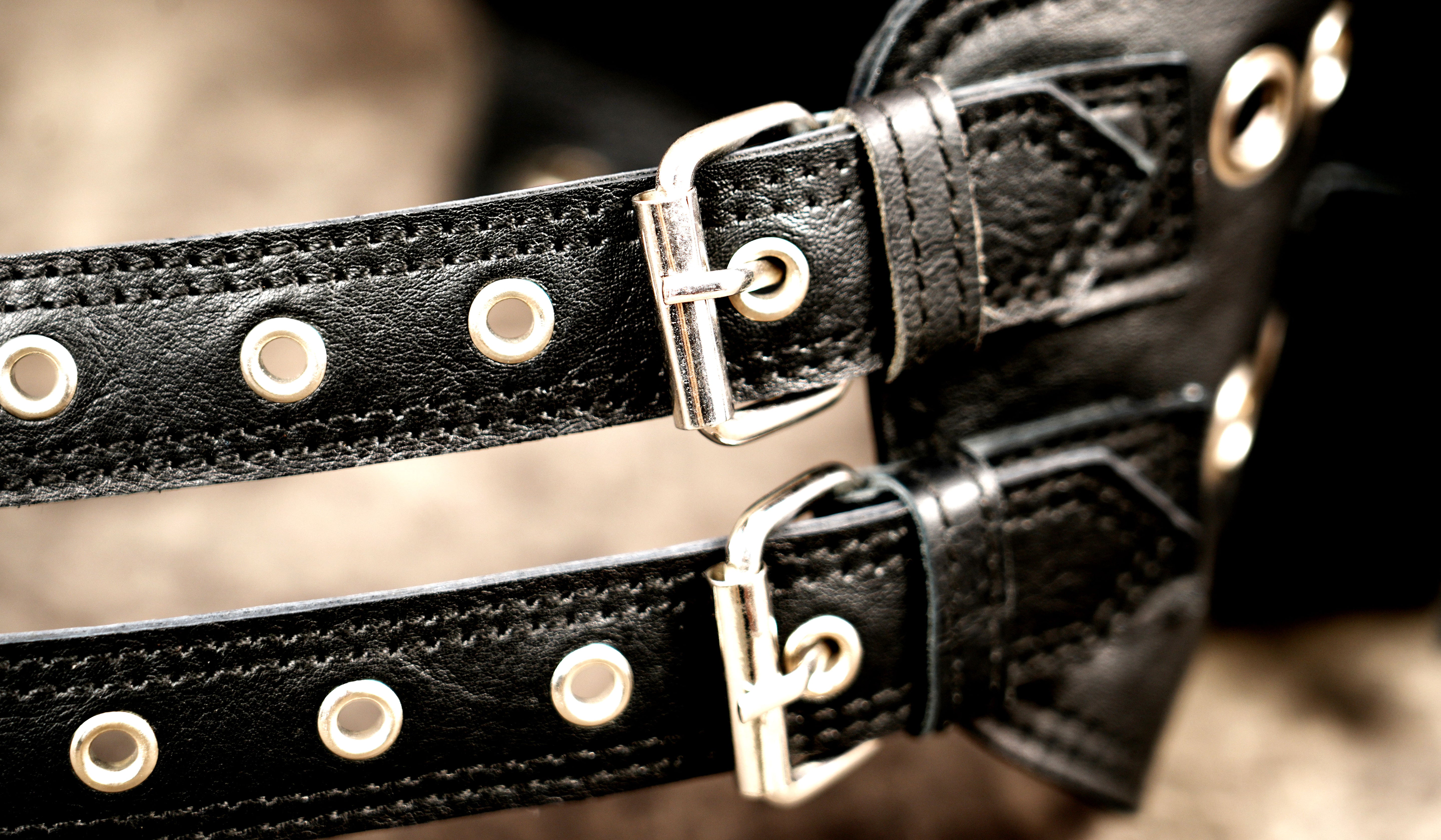 Genuine leather multi pocket belt styled on stone background