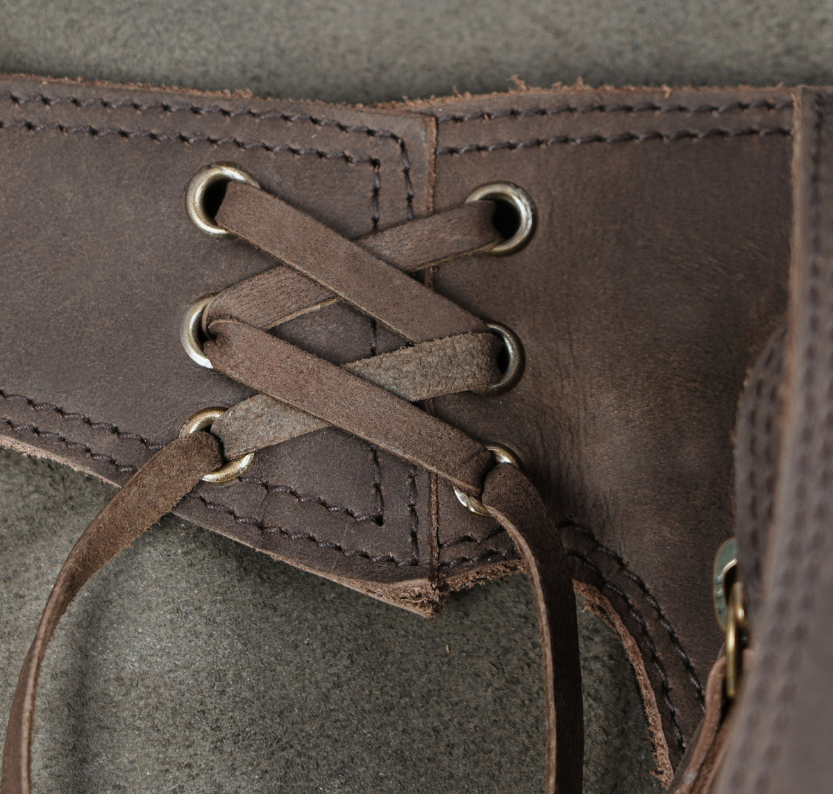 Genuine leather thigh pouch styled on stone background