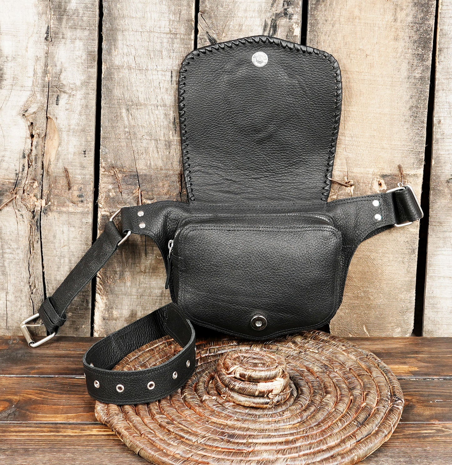 Genuine leather waist bag styled on rustic wood background