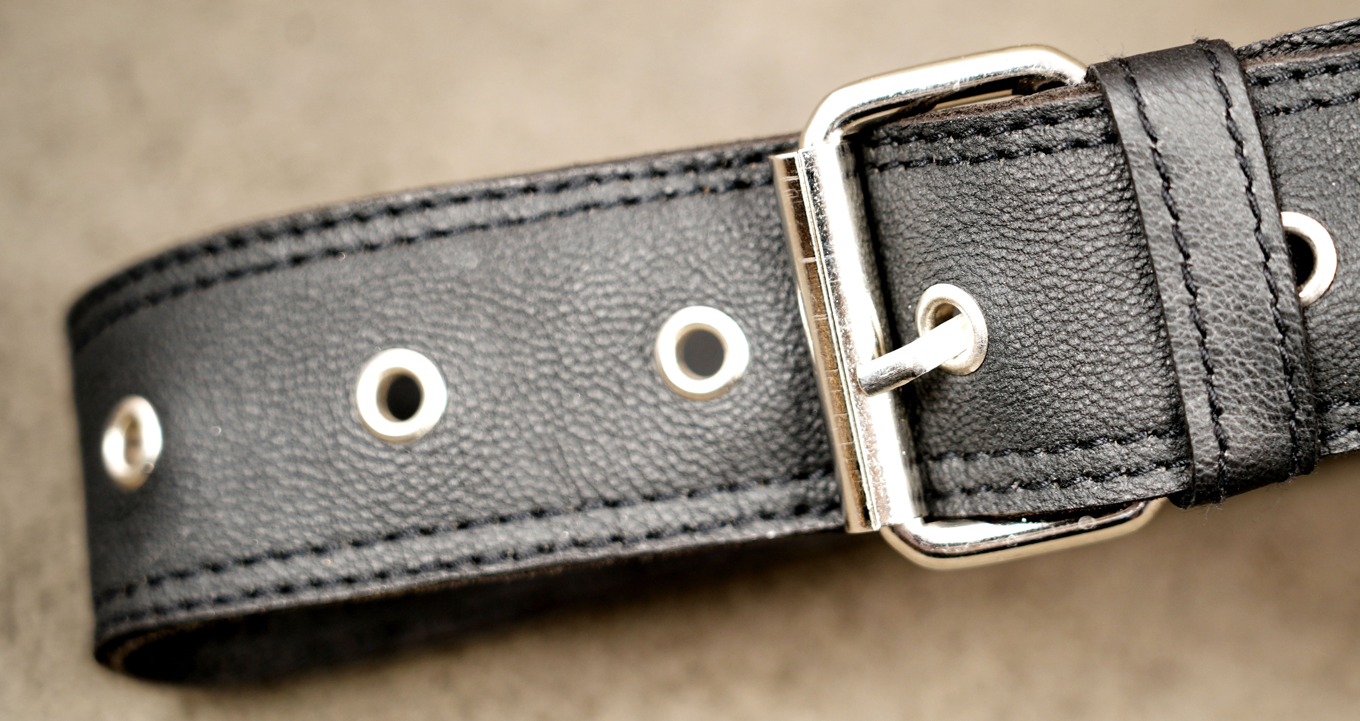 Genuine leather waist bag styled on stone background