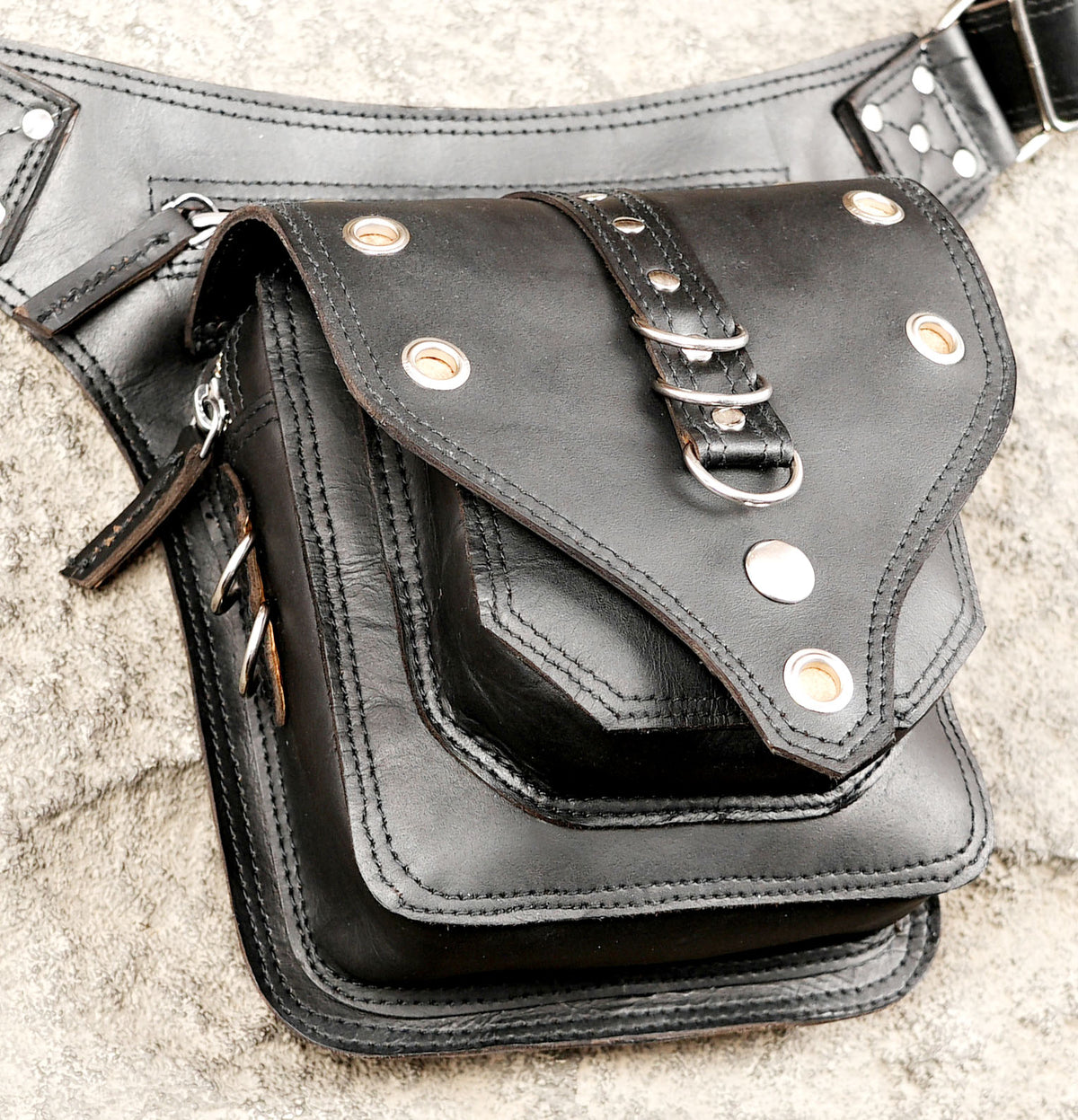 Genuine leather fanny pack styled on stone background