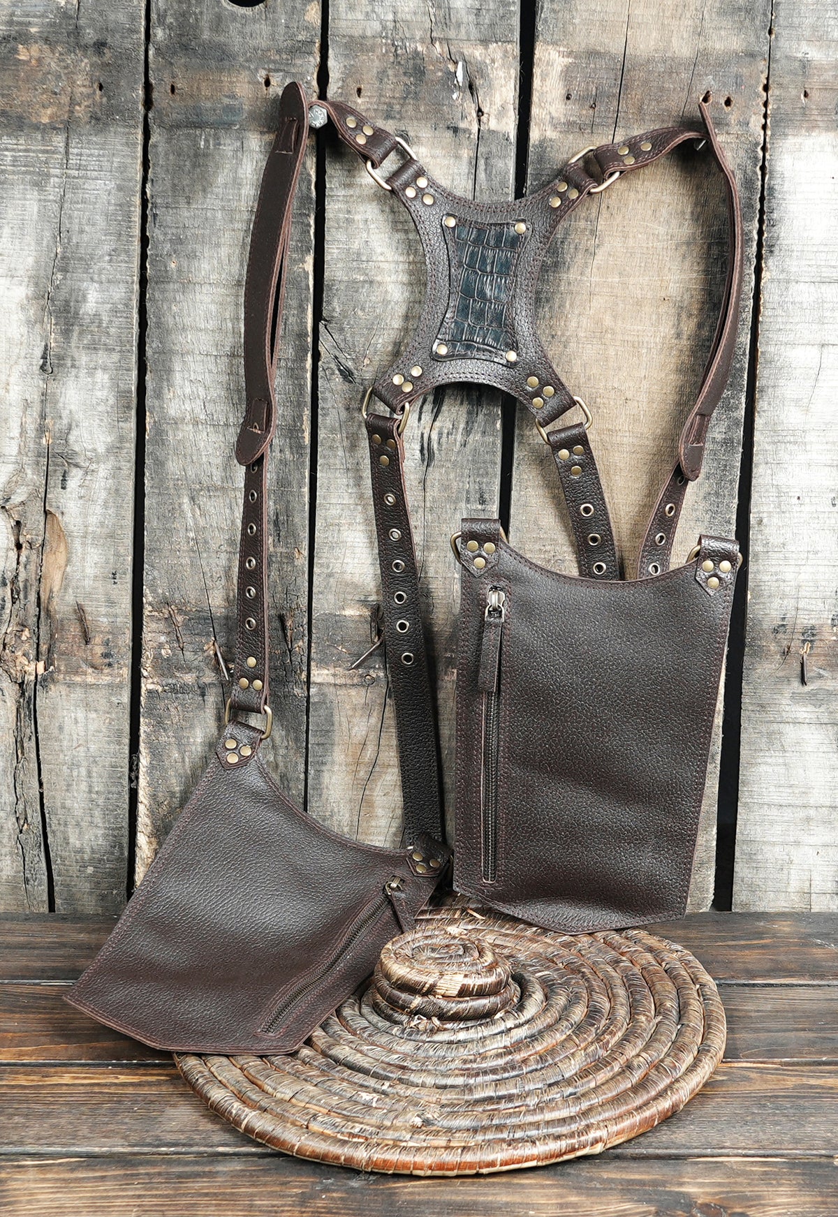 Unisex leather thigh holster belt with two large pouches for carrying everyday essentials.
