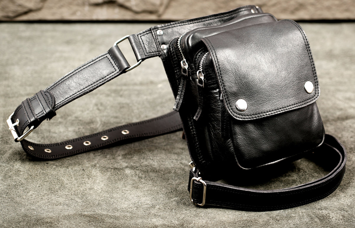 Glossy black leather hip pouch with snap closure
