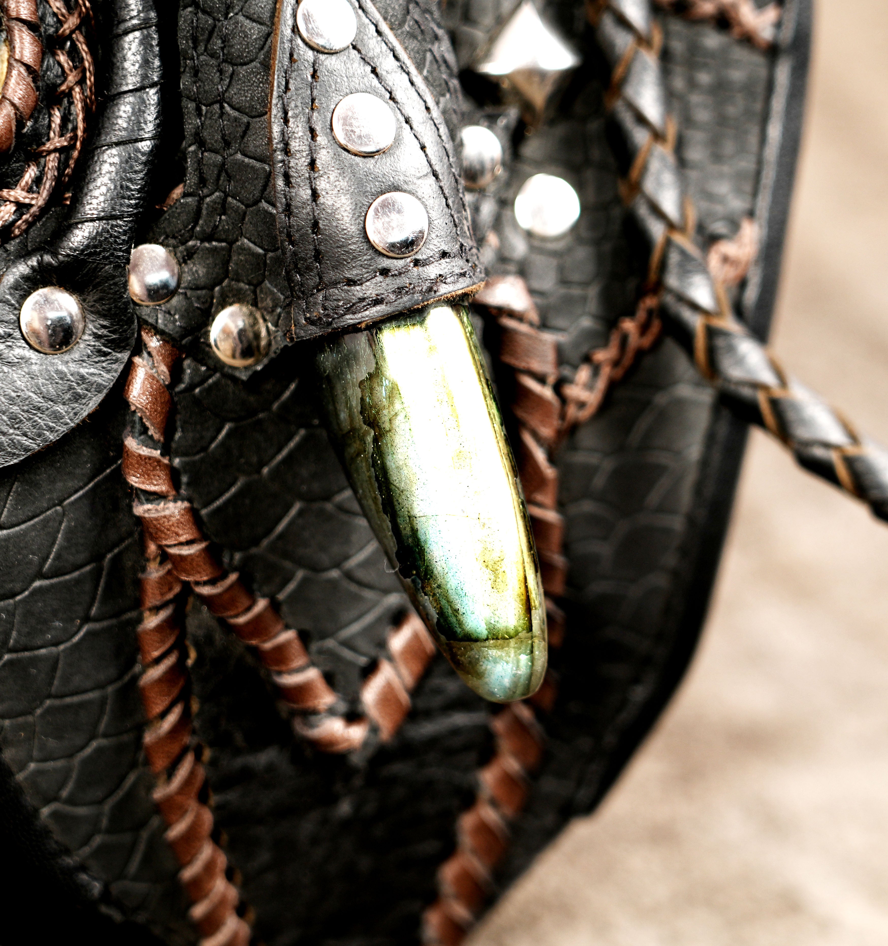 Gothic black leather utility bag with decorative stones