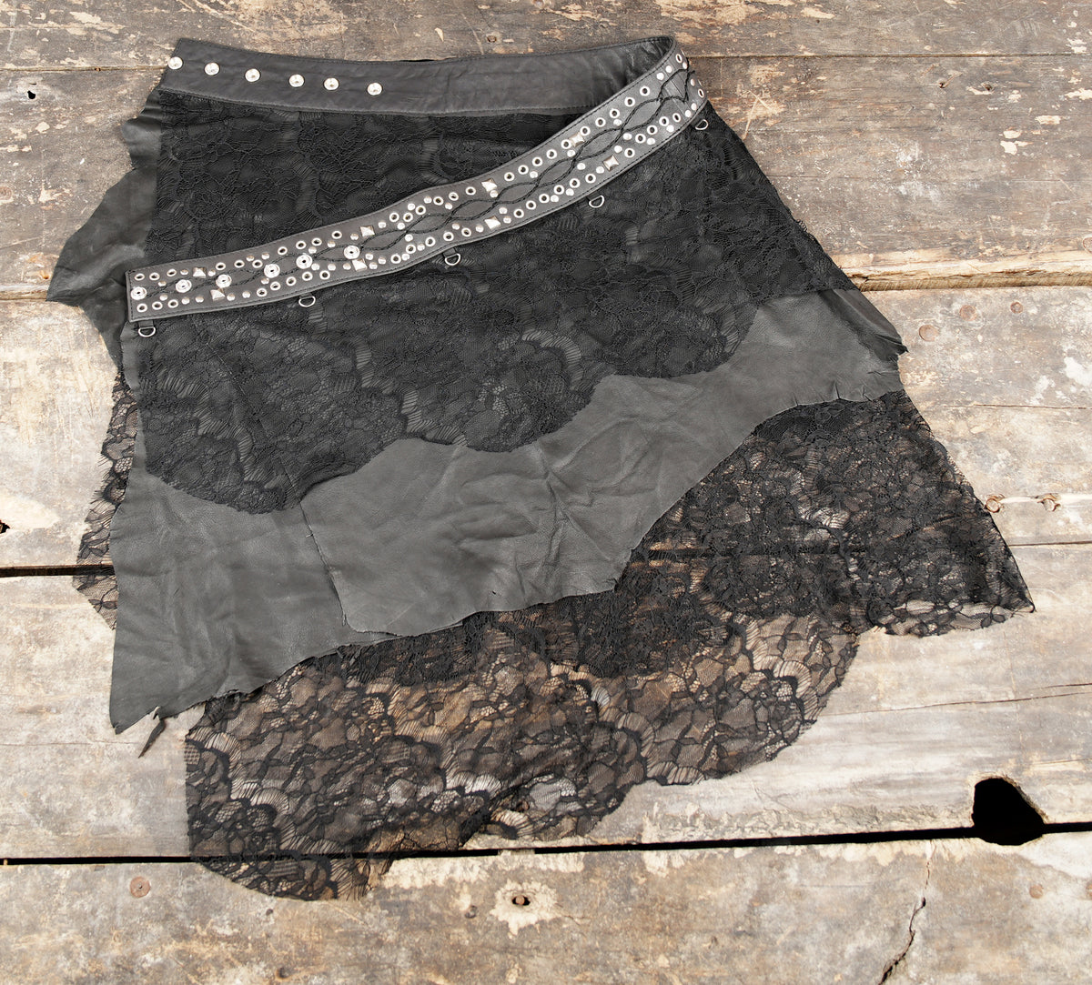 Gothic leather and lace skirt with silver-tone eyelet details