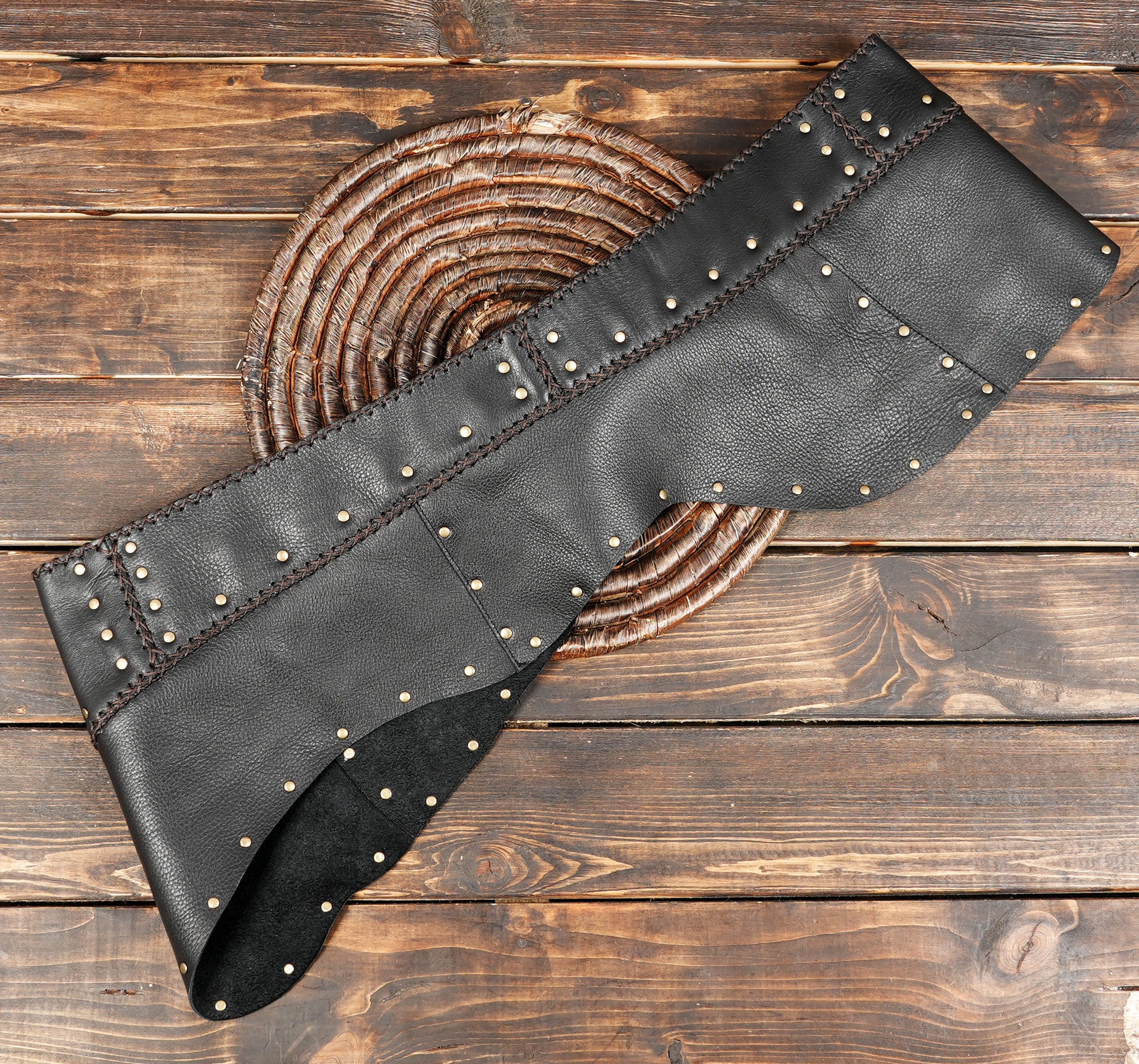 Gothic leather mini skirt with brass hardware detail