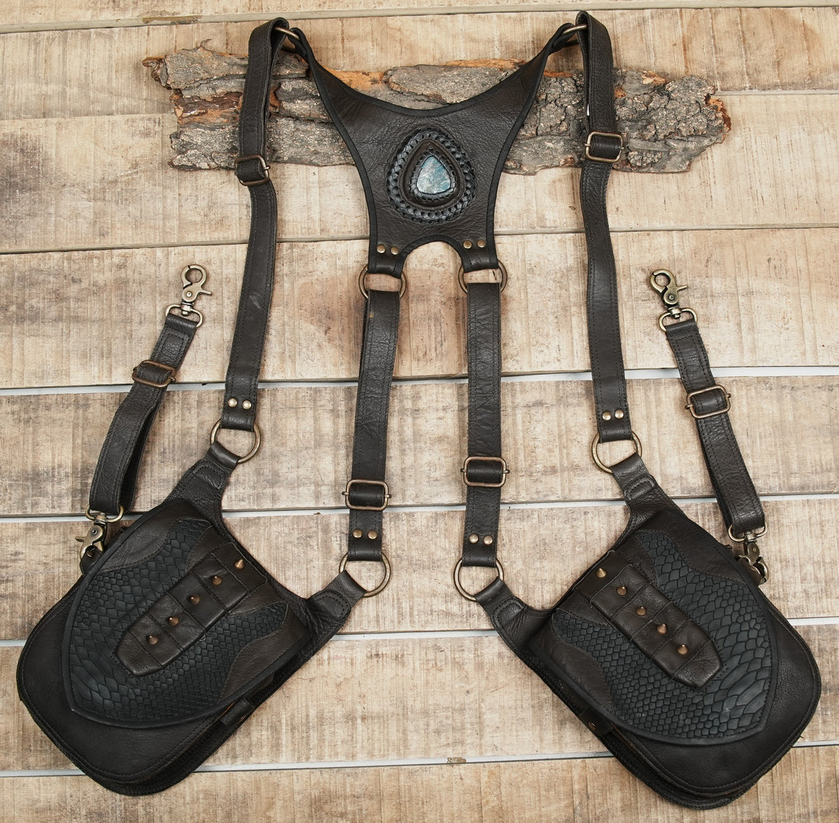 Double hip holster bag with black textured leather panels and metal stud accents