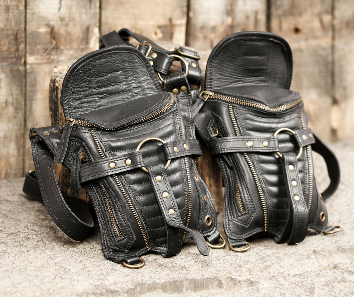 Alternative fashion waist bag with two black pouches and decorative metal eyelets