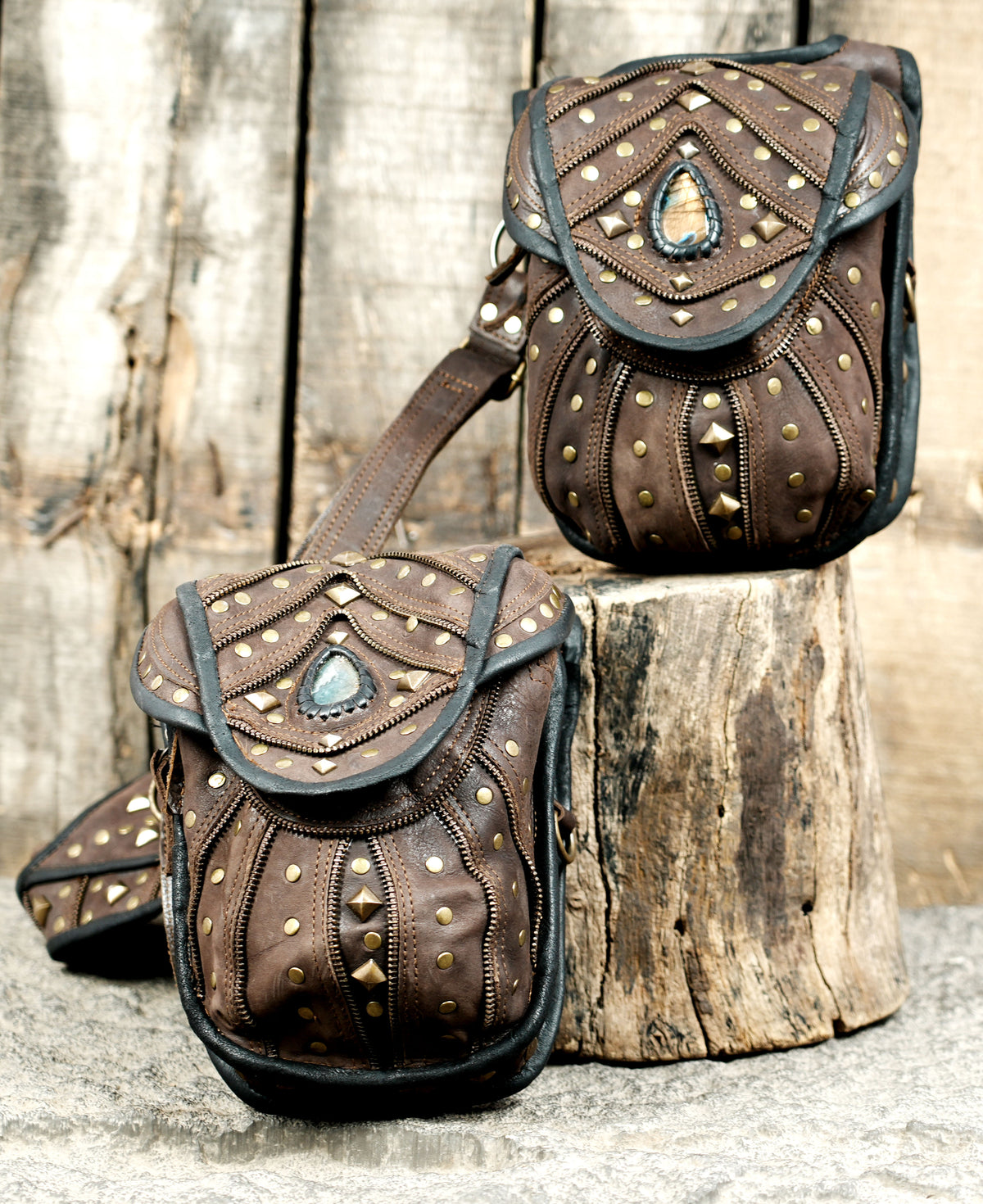 Handcrafted leather utility harness with twin storage bags and decorative metal studs