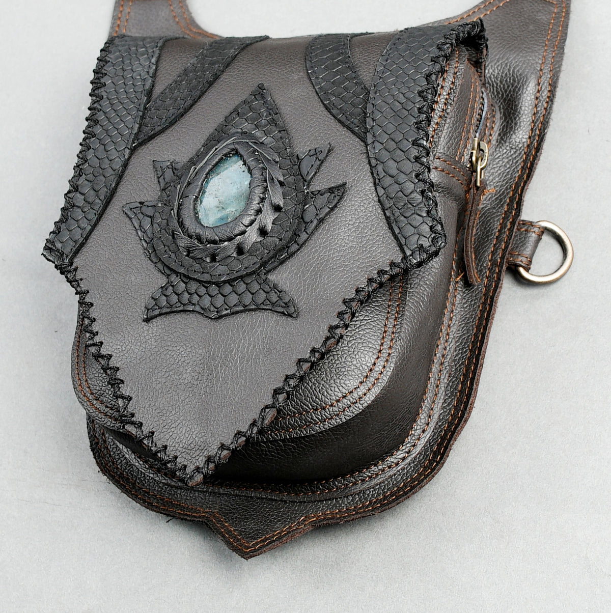 Gothic festival accessory featuring a grey leather double hip pouch harness with stone details.