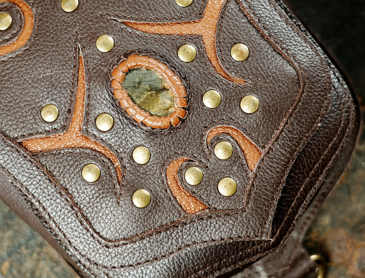 Black leather double holster bag with antique brass rings and adjustable straps