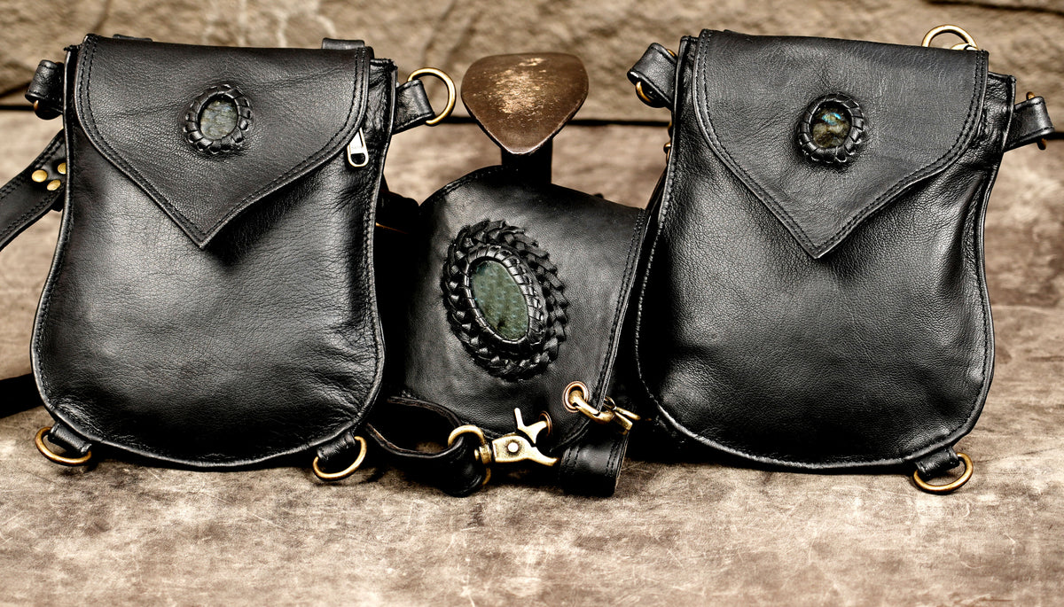 Black leather shoulder harness with matching detachable utility pouches