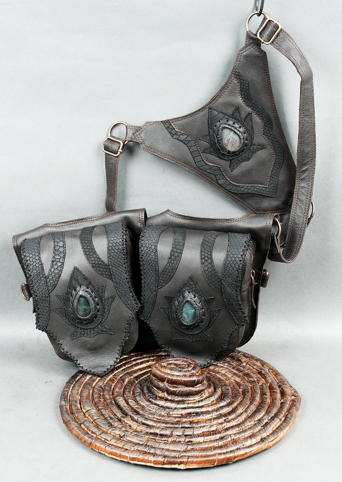 Steampunk double hip pouch belt with grey leather panels braided edges and stone embellishments.