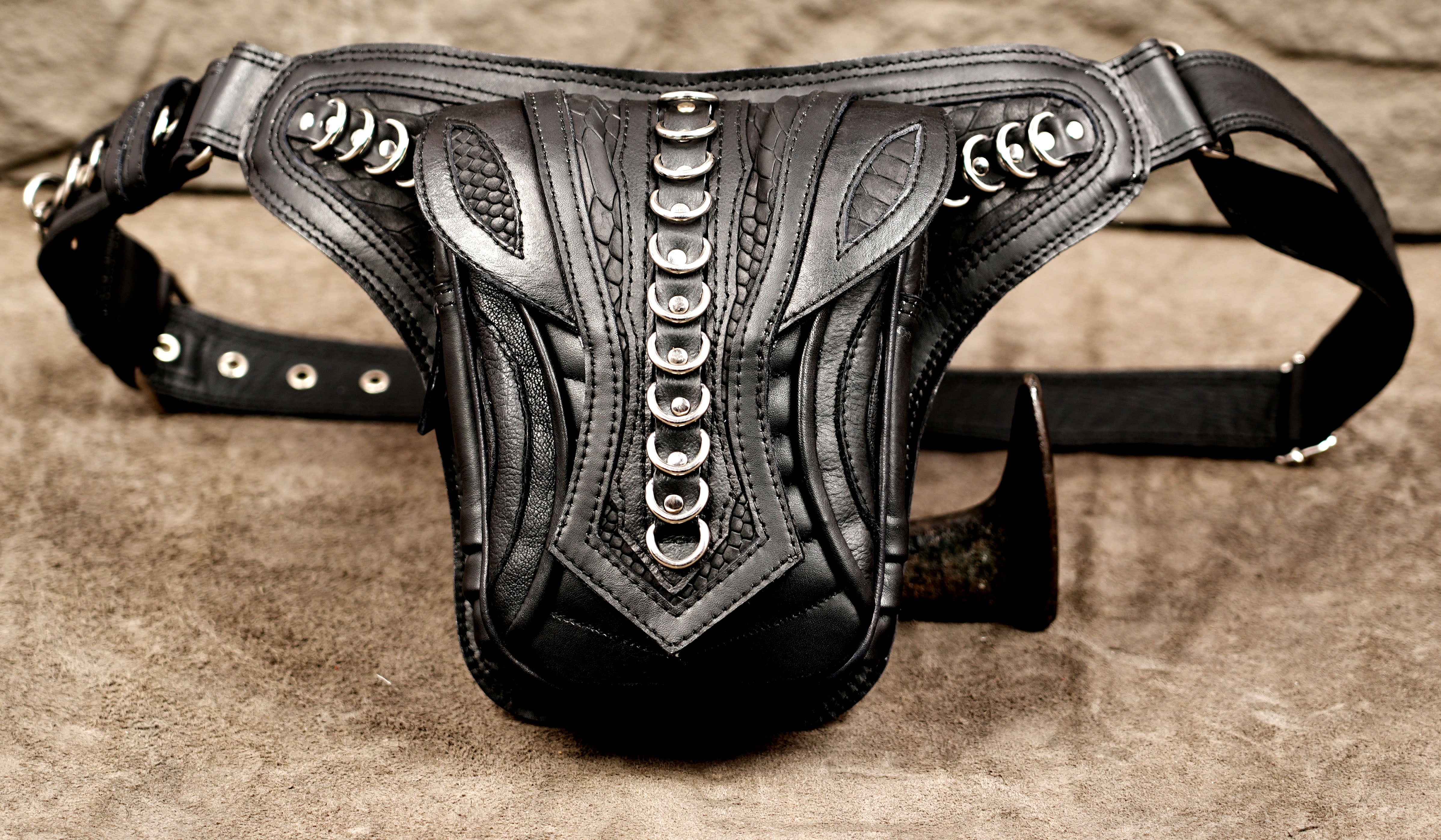 Grunge style leather waist pouch with hardware accents