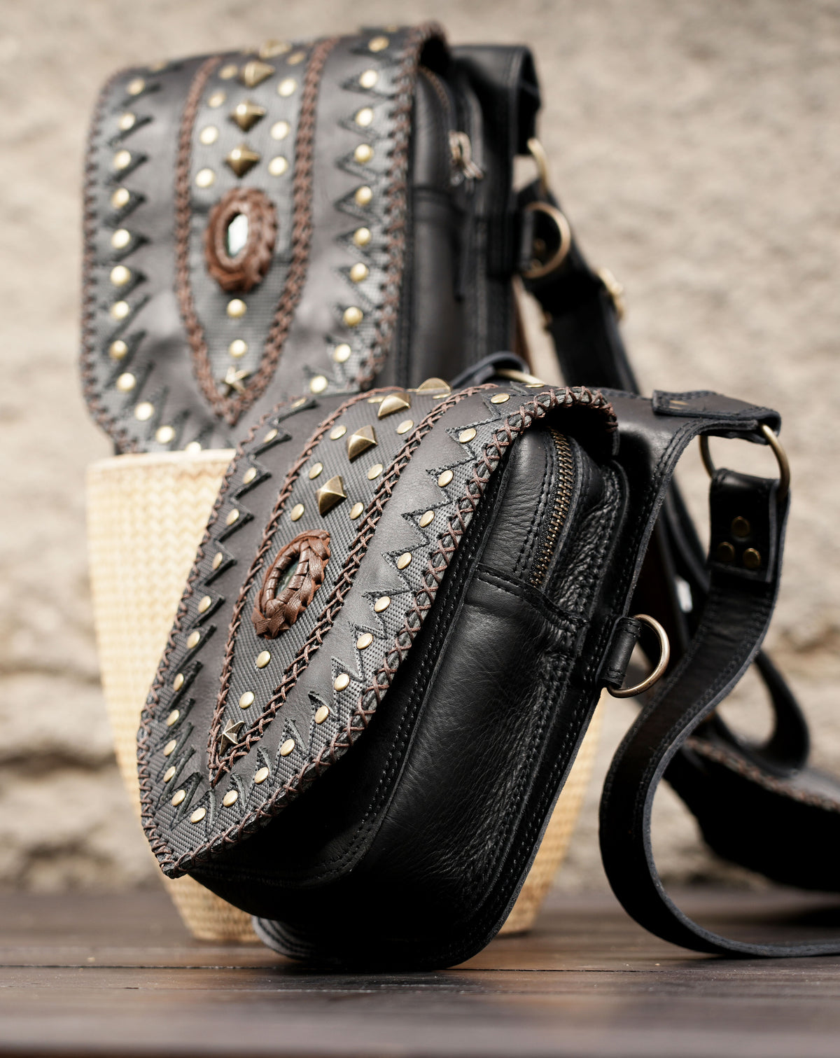 Handcrafted leather festival hip bags with decorative studs and adjustable straps
 