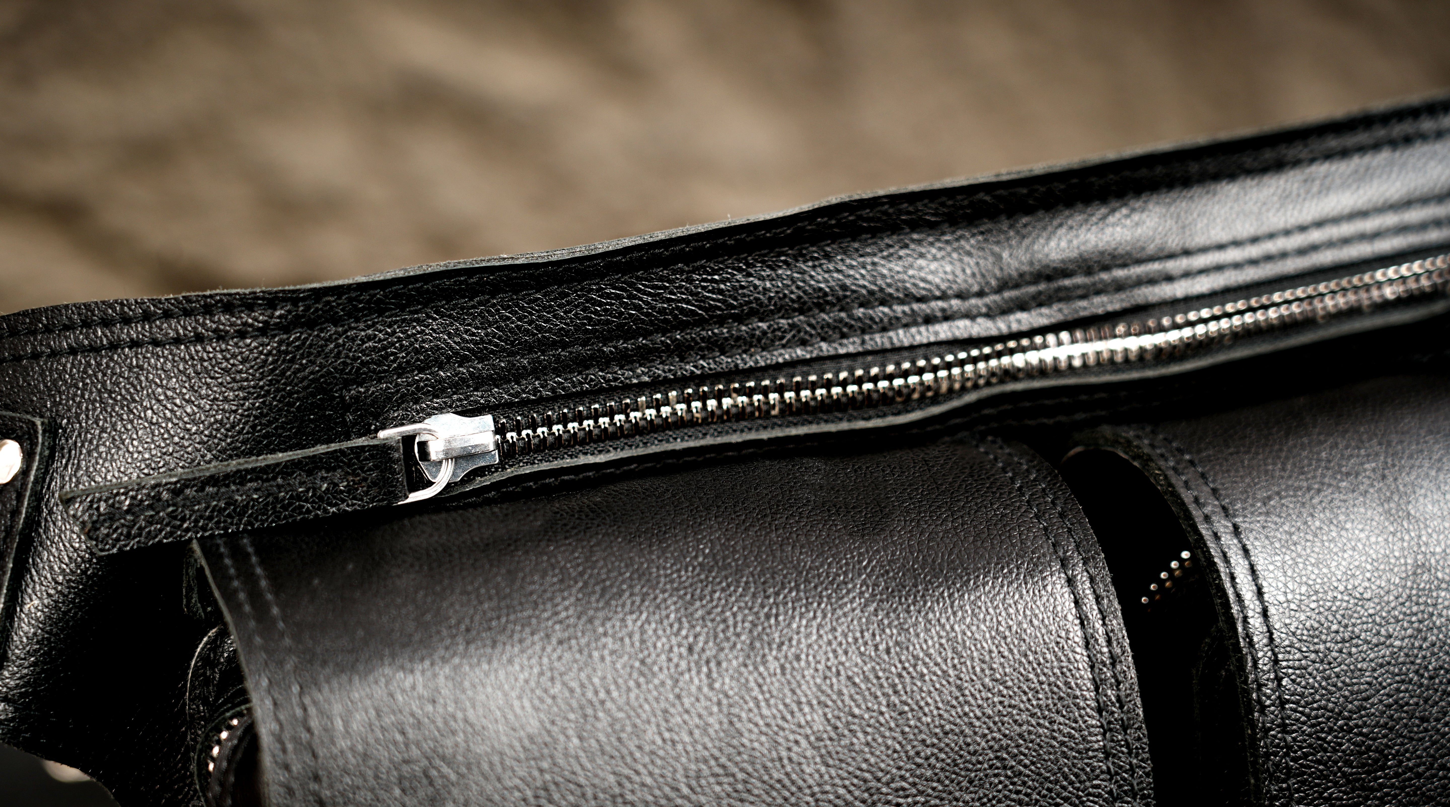 Handcrafted leather utility bag with two snap closures