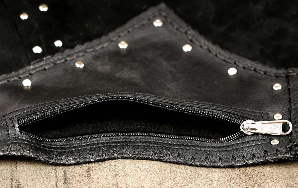 Handcrafted black leather skirt with decorative metal studs
