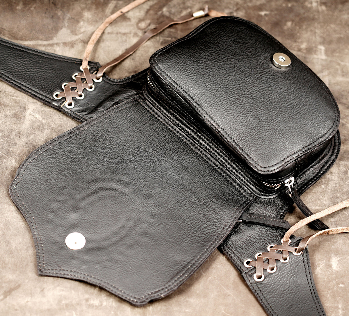 Handcrafted leather bag with hanging tassel fringe