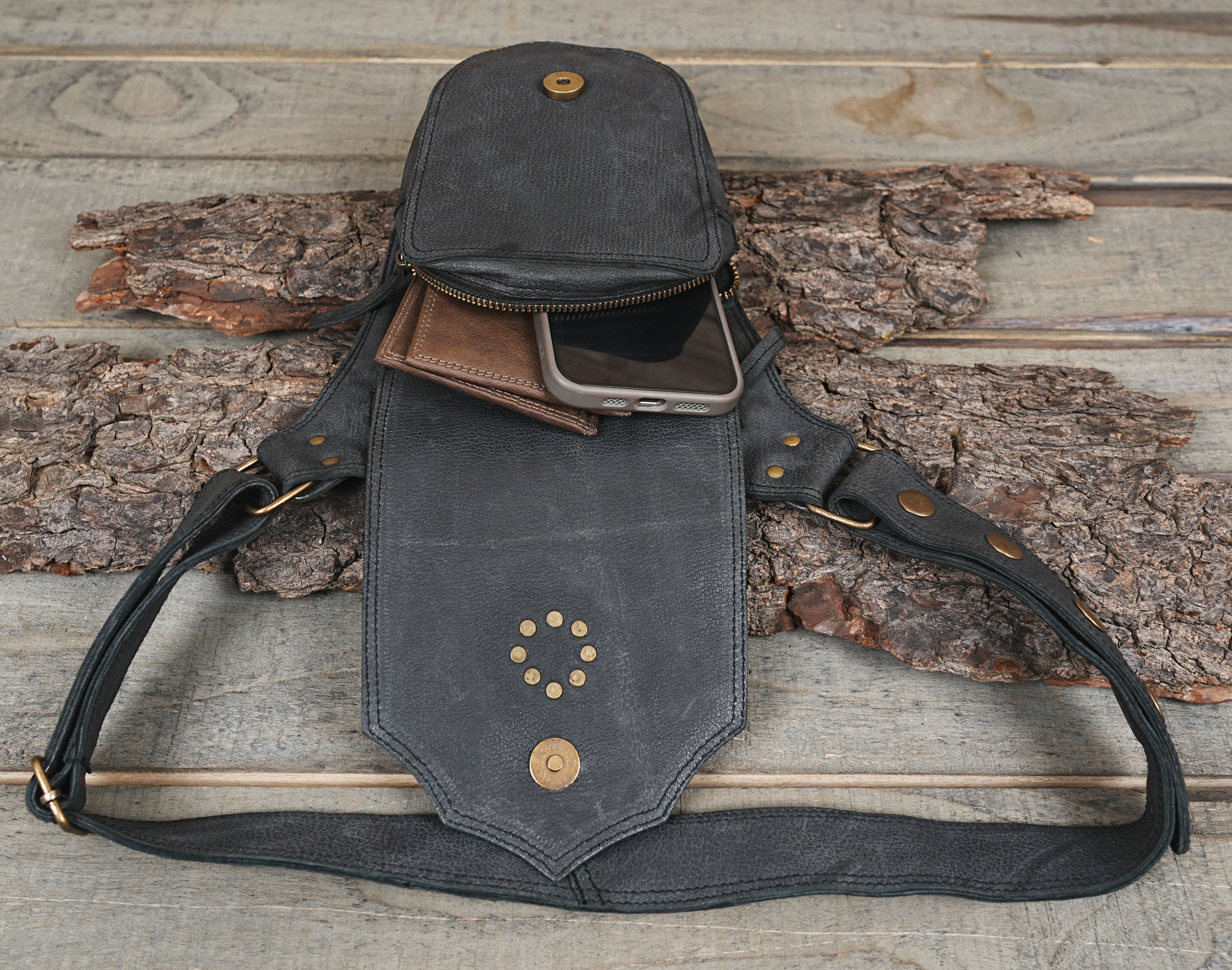 Handcrafted leather bag with tan star medallion and brass stud accents