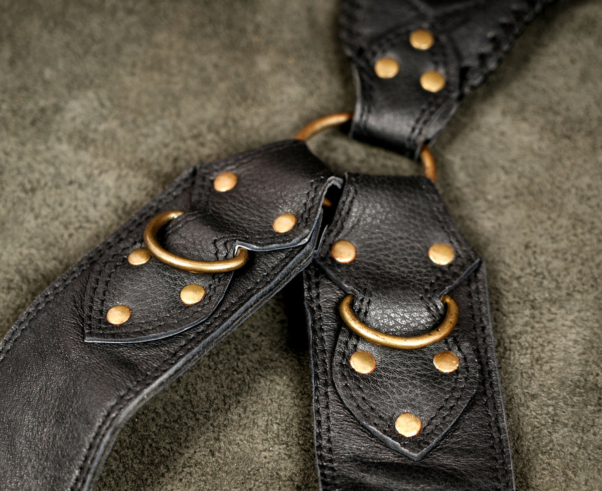 Handcrafted leather chest rig with braided stone medallions