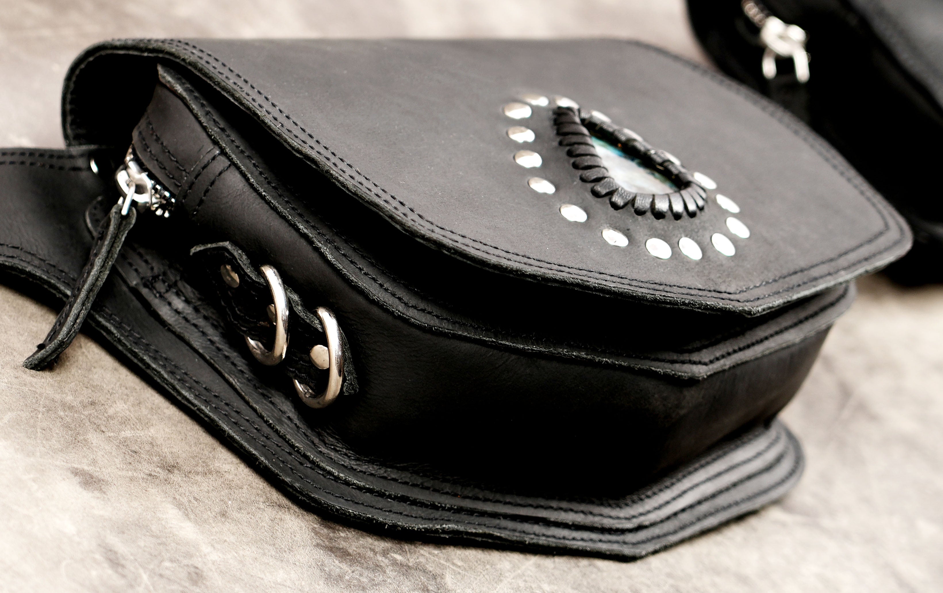 Handcrafted leather festival bag with gemstone centerpiece