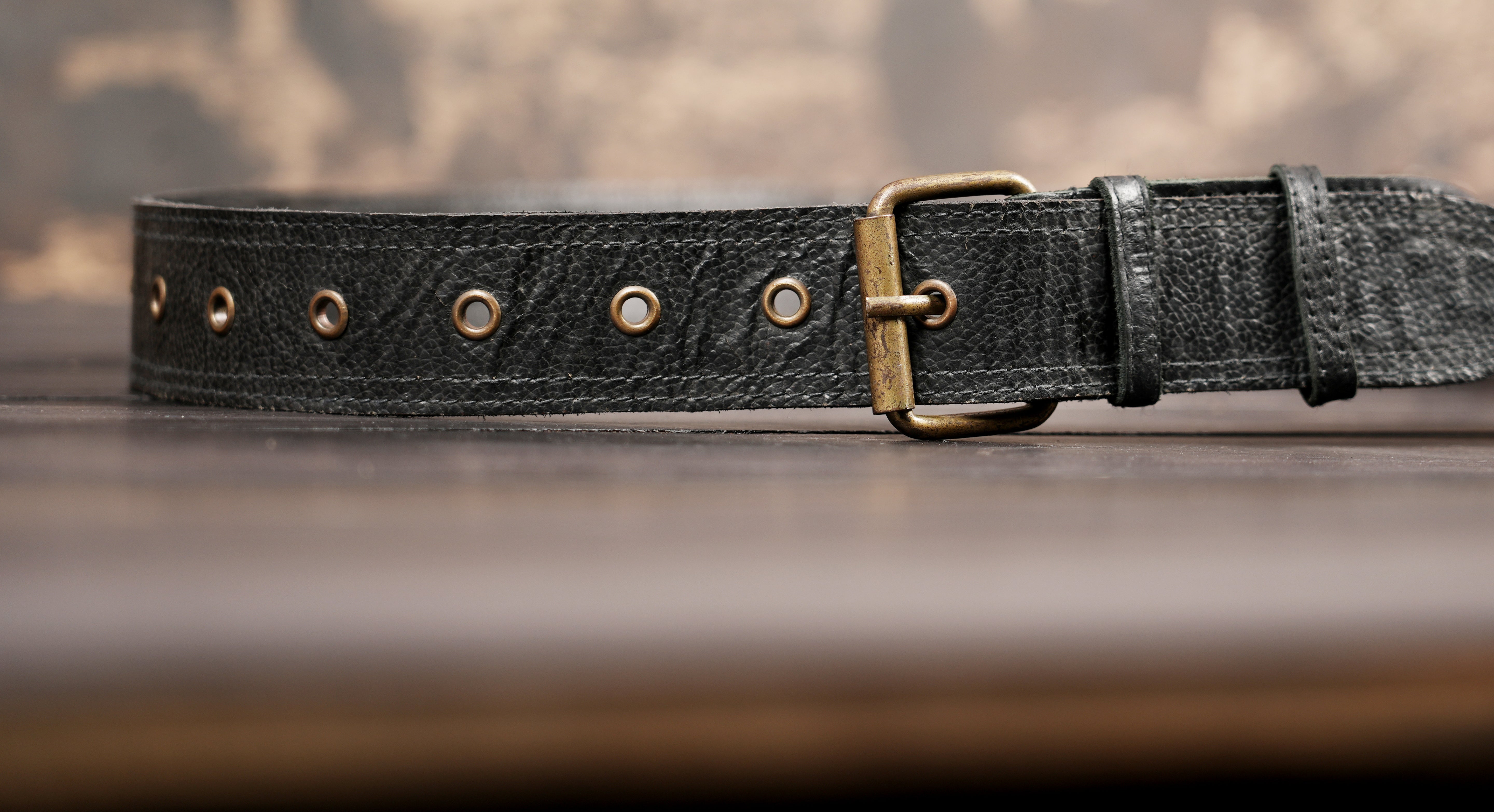 Handcrafted leather hip bag with brass ring hardware detail