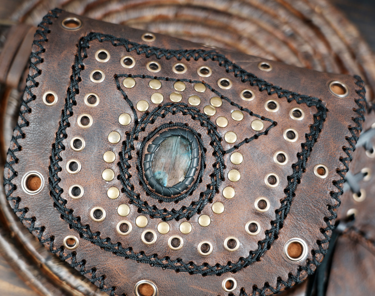 Handcrafted leather skirt with whipstitch trim and crystals