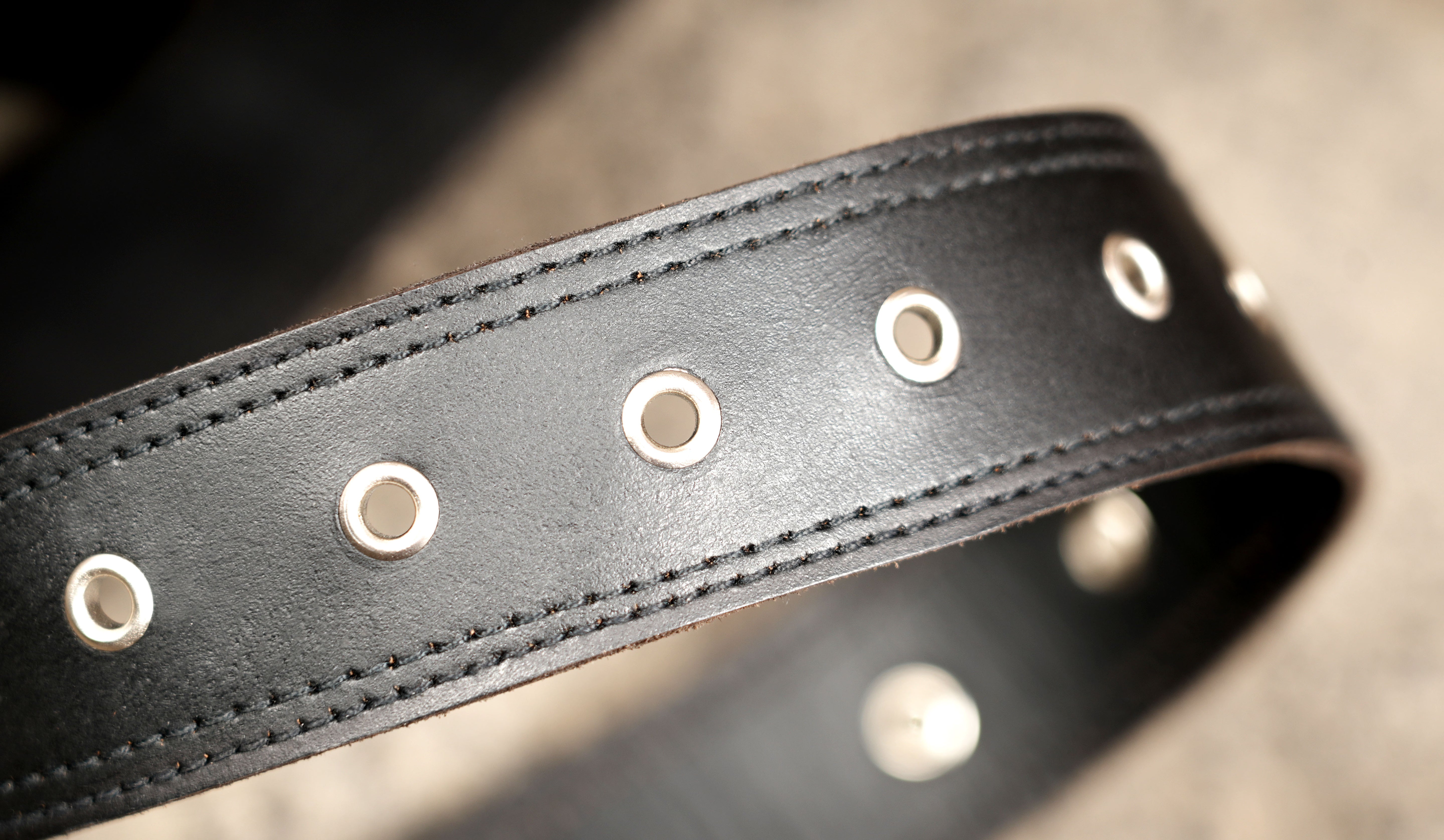 Handcrafted leather utility bag with silver stud trim