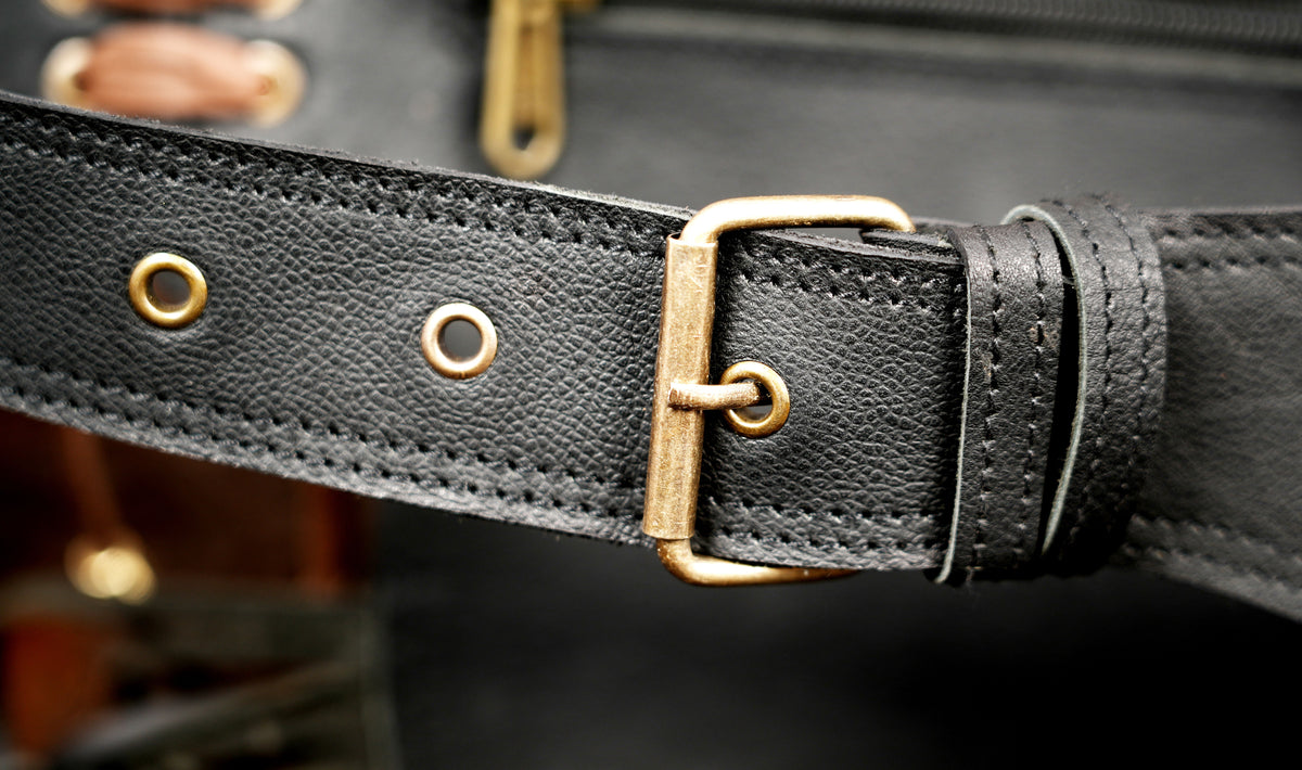 Handcrafted leather waist belt with fringe pouches and studs