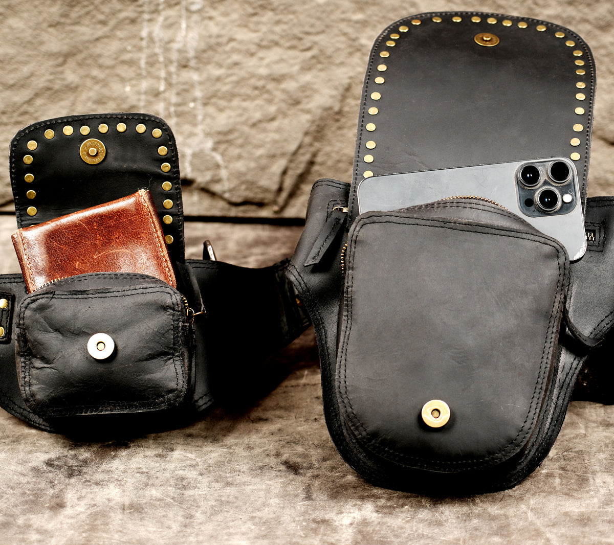 Handcrafted leather waist belt with studded pouches, close up