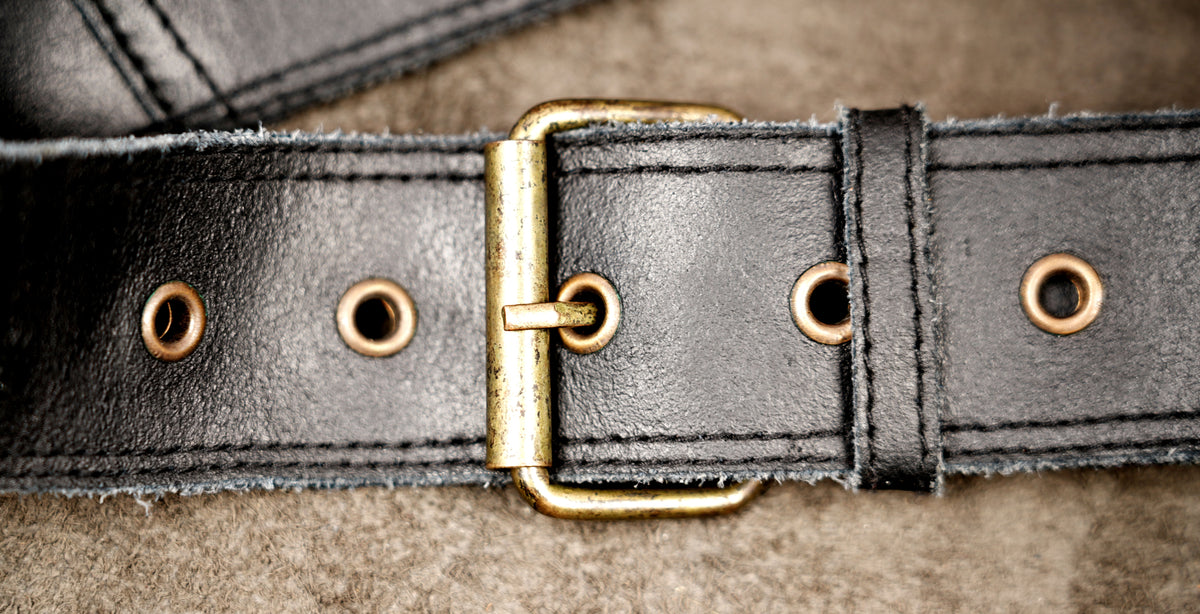Handcrafted leather waist pouch with two tone medallion design